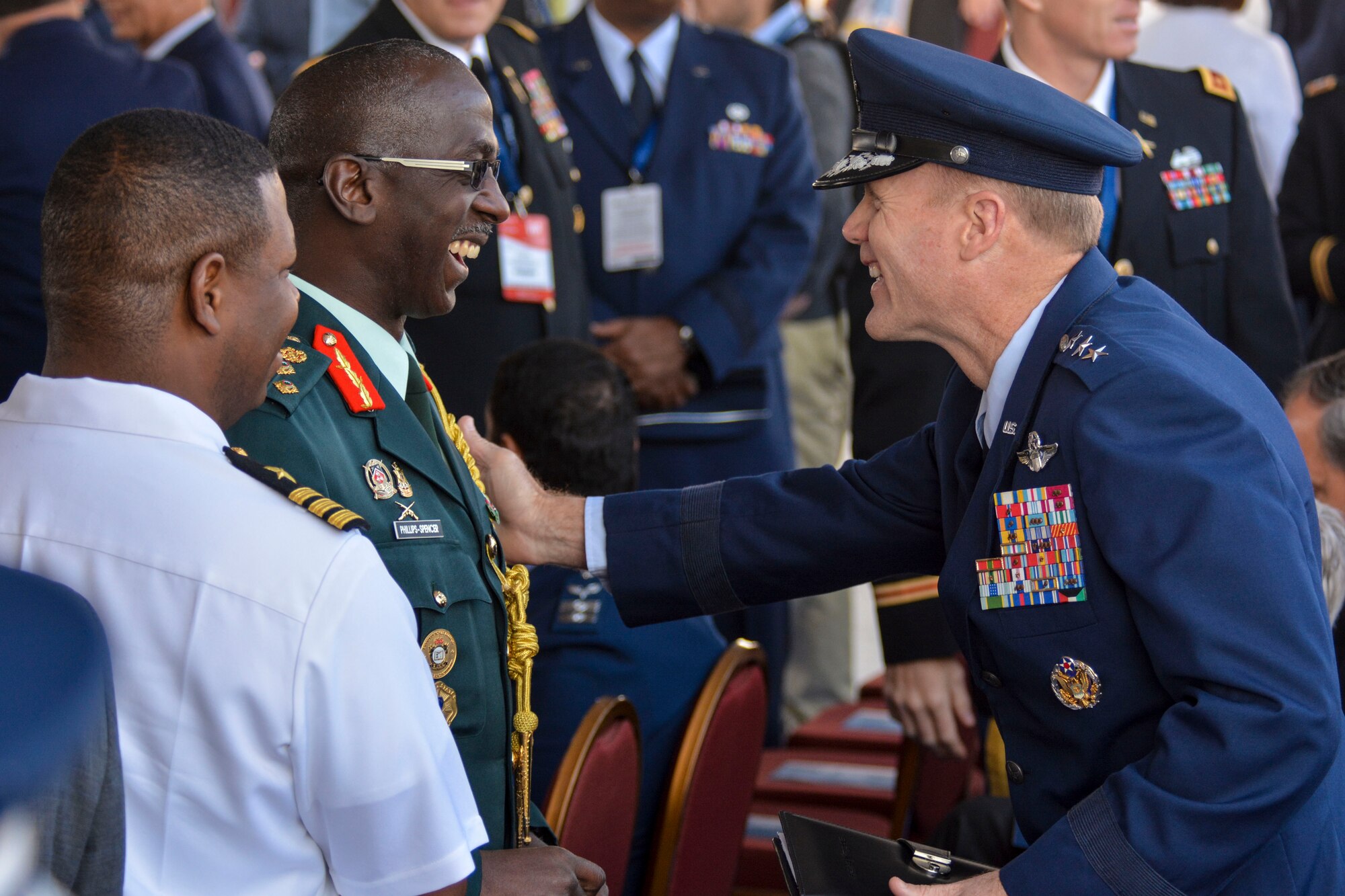 Lt. Gen. Tod Wolters, 12th Air Force (Air Forces Southern) commander, greets Brig. Gen. Anthony Phillips-Spencer, vice chief of Defence Staff of the Trinidad and Tobago Defence Force, just before the FIDAE Air Show opening ceremony in Santiago, Chile, March 25. Nearly 60 U.S. airmen are participating in subject matter expert exchanges with Chilean air force counterparts during FIDAE, and as part of the events will host static displays of the C-130 Hercules and F-16 Fighting Falcon. The exchanges, conducted regularly throughout the year, involve U.S. Airmen sharing best practices and procedures to build partnerships and promote interoperability with partner-nations throughout South America, Central America and the Caribbean. (U.S. Air Force photo by Capt. Justin Brockhoff/Released)