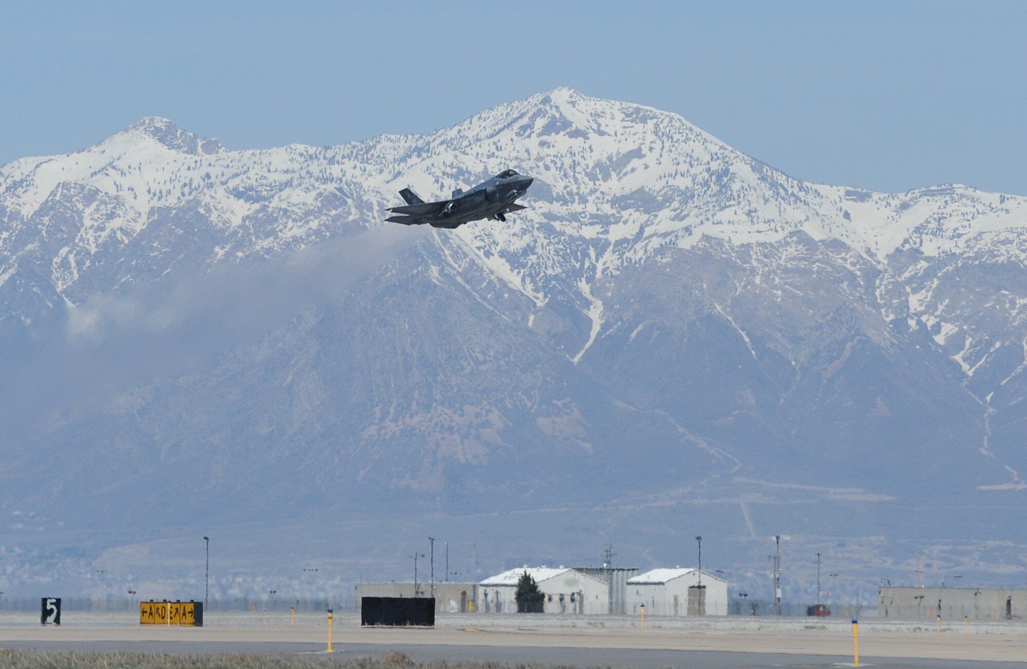 The first F-35 Lightning II to receive organic modifications at the Ogden Air Logistics Complex departed Hill Air Force Base March 25 for Nellis AFB, Nev., where it will undergo continued operational testing. The aircraft arrived at Hill AFB in September 2013 and received four structural modifications intended to strengthen areas of the aircraft and extends its service life. The Ogden ALC is expected to perform the series of modifications on a total of six F-35s this fiscal year. Eight F-35s are expected to be inducted into the depot in FY15. (U.S. Air Force photo by Alex R. Lloyd)
