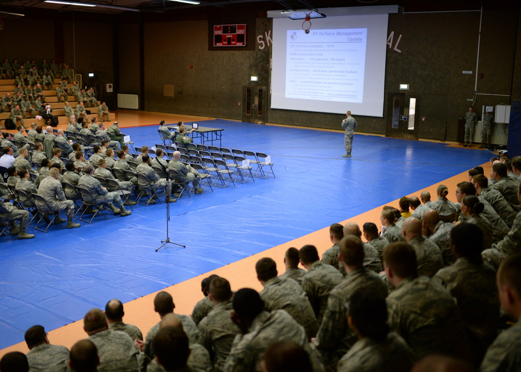 U.S. Air Force Chief Master Sgt. Matt Grengs, 52nd Fighter Wing command chief from Longmont, Colo., shares the most current information about the Air Force's force management program during a mass briefing in the Skelton Memorial Fitness Center at Spangdahlem Air Base, Germany, March 26, 2014. More than 300 enlisted Airmen attended the commander’s call to understand the base leadership's vision for the future of Spangdahlem. (U.S. Air Force photo by Staff Sgt. Daryl Knee/Released)