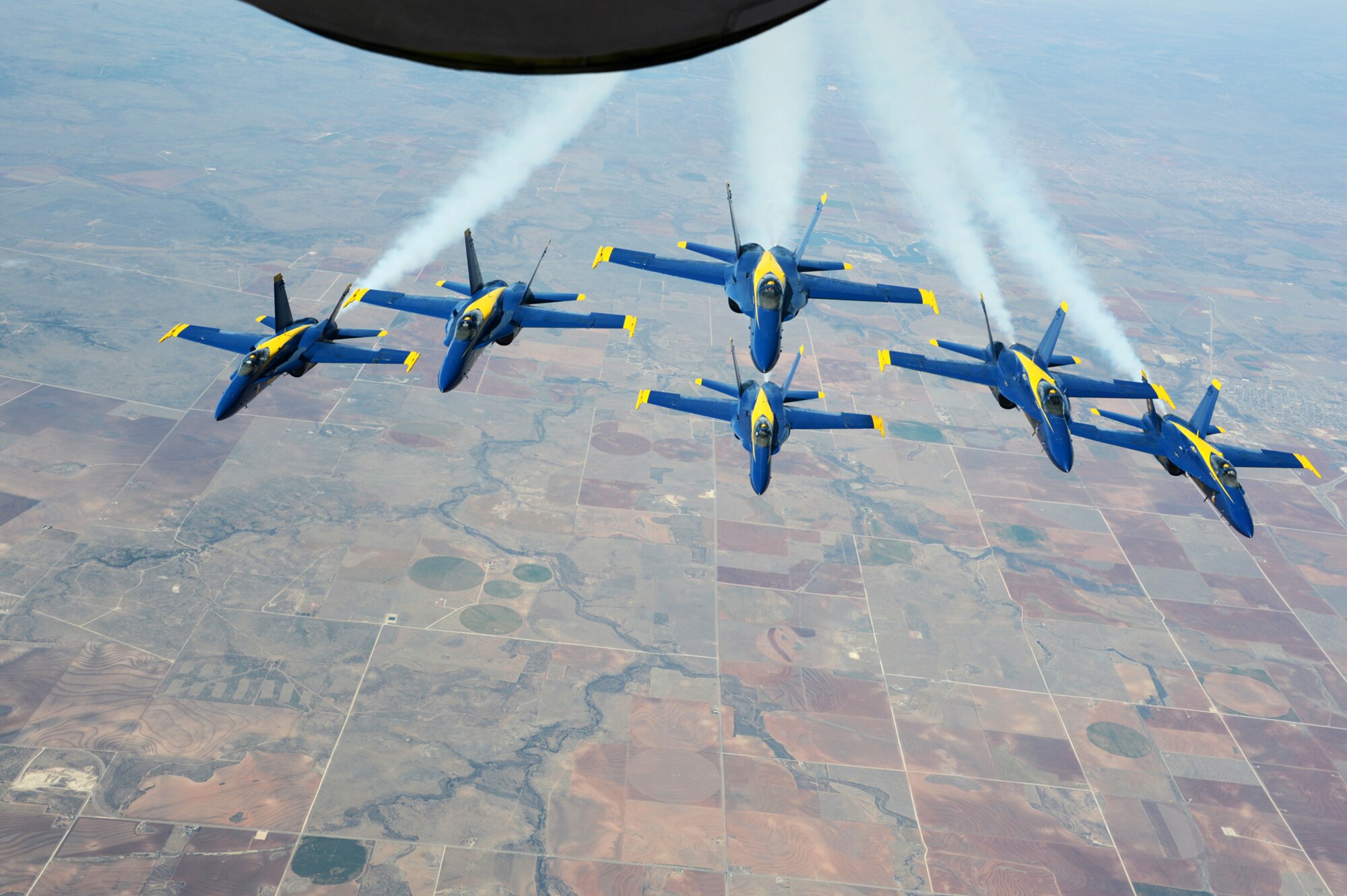 A Crew from the 137th Oklahoma Air National Guard Air Refueling Wing had the rare opportunity to provide aerial refueling support to a Navy Blue Angels squadron Monday March 24, 2014.  The squadron was making their way back from their winter home at Naval Air Facility, El Centro Calif., to Naval Air Station, Pensacola Fla., to prepare for the upcoming season.  The 137th ARW picked up the Blue Angels in New Mexico and refueled six single seat F/A 18 Hornets and a two-seat trainer all the way to eastern Texas.  Upon completing the mission, the Blue Angels formed up behind the stratotanker and then finished their journey to Florida.    