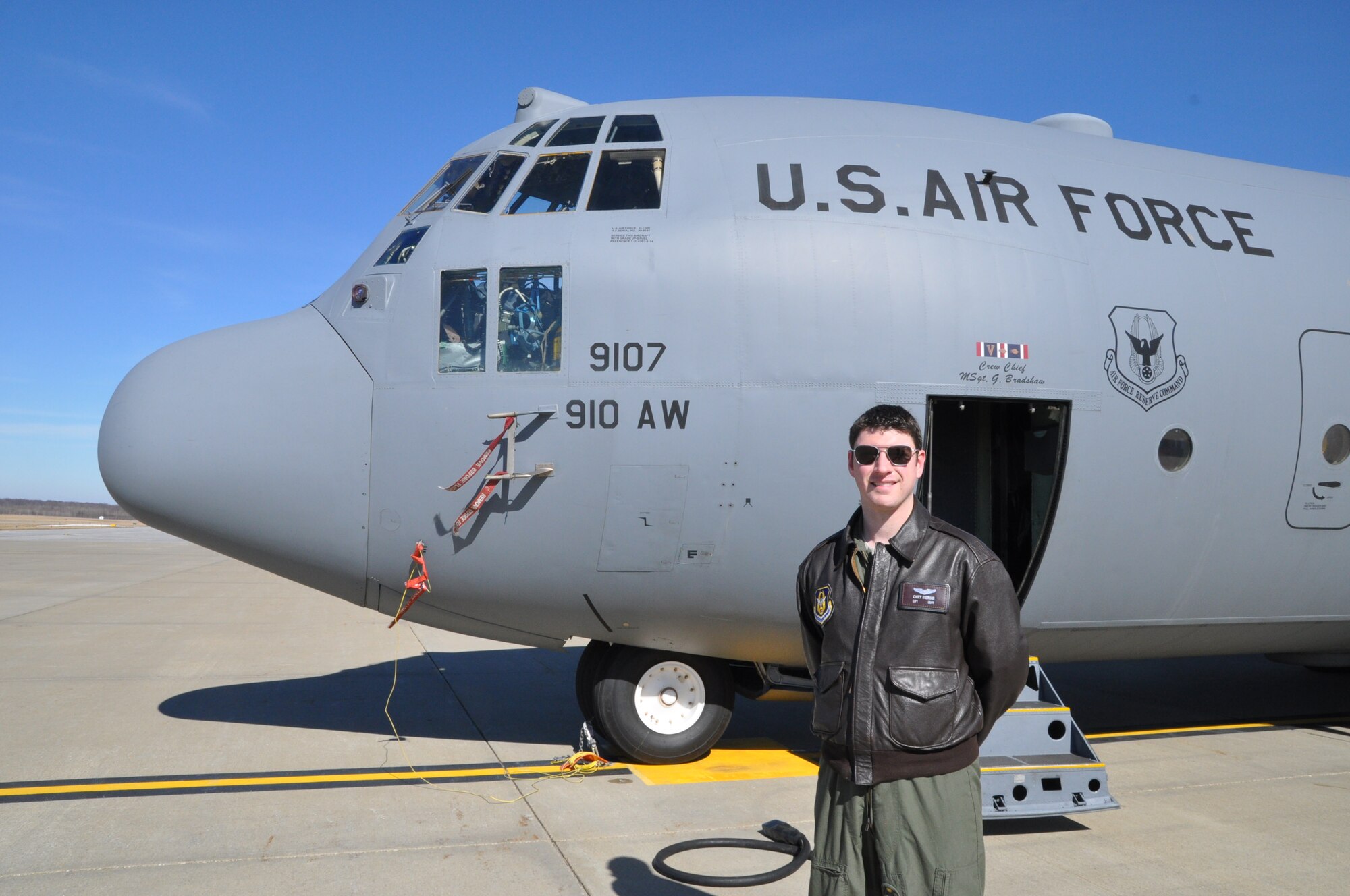 U.S. Air Force Reserve Capt. Casey Stedman, a navigator with the 773rd Airlift Squadron, poses is front of a Youngstown C-130H Hercules aircraft here. Stedman will spend four months in a geodesic dome, beginning March 28, 2014, as the mission commander for Hawai'i Space Exploration Analog and Simulation's (HI-SEAS) mission two, The mission is designed to simulate a long-term manned mission to Mars. Stedman is part of a six-person team. (U.S. Air Force photo/Master Sgt. Bob Barko, Jr.)