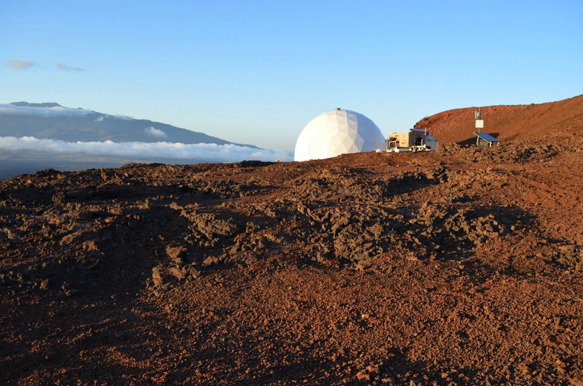 This courtesy photo, taken during the first HI-SEAS mission in 2013, shows the HI-SEAS habitat and Mars-like landscape on the slope of Mauna Loa. U.S. Air Force Reserve Capt. Casey Stedman, a navigator with the 773rd Airlift Squadron here, will spend four months in the habitat, beginning March 28, 2014, as the commander of mission two. (Courtesy photo by Dr. Sian Proctor)