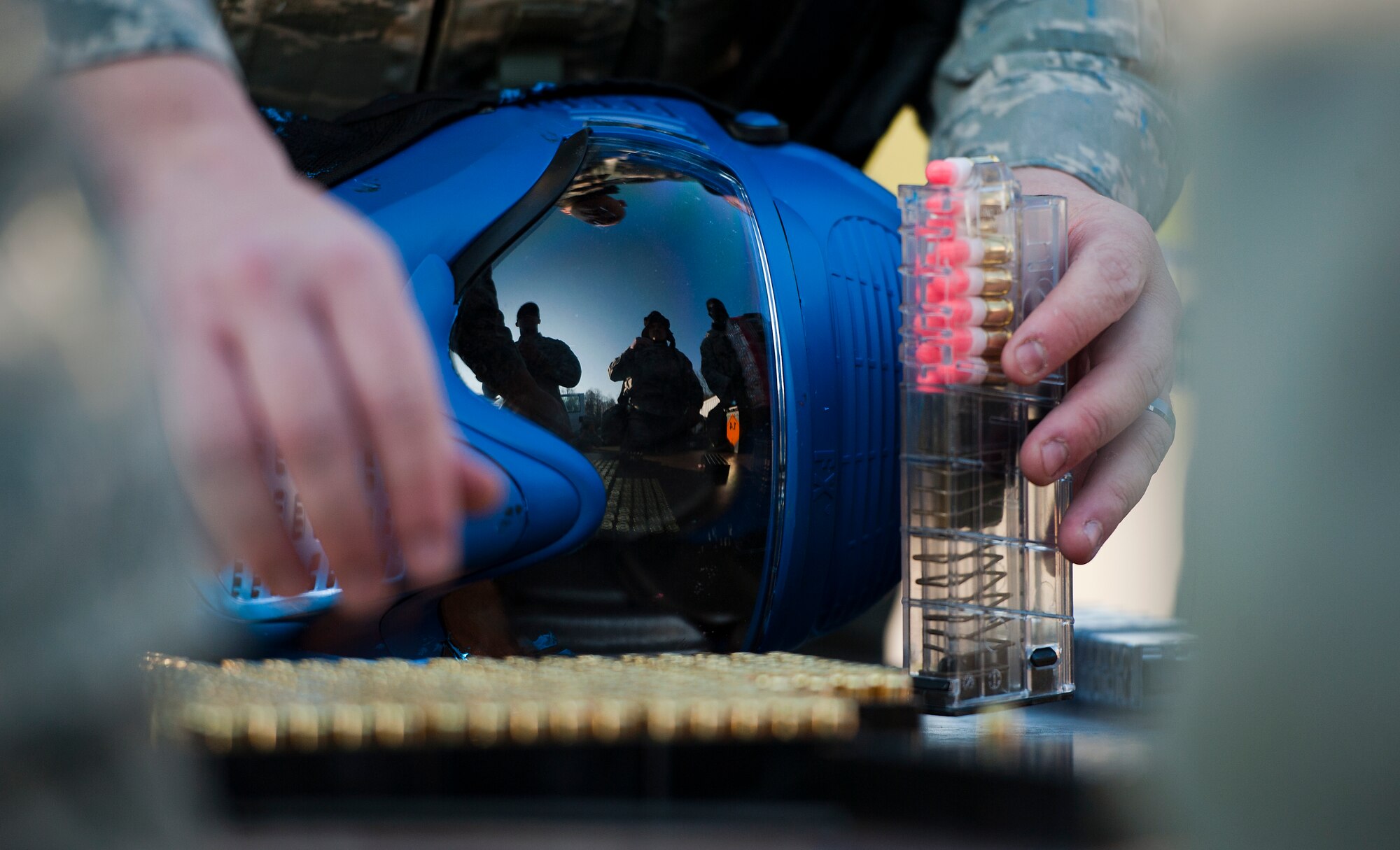 Airmen load simulation rounds in their magazine during the Battlefield Leaders, Assaulters Course, March 12, 2014, Ramstein Air Base, Germany. Members of the 435th SFS taught Airmen a variety of skills during the course, including advance tactics, shooting and leadership. (U.S. Air Force photo/Senior Airman Damon Kasberg)