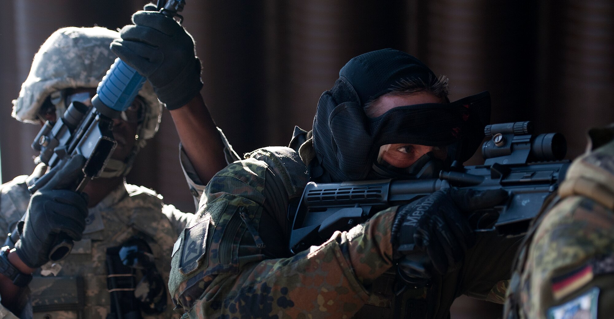 Master Sgt. Christoph Czaja, German air force security forces squadron member, assaults a complex along with fellow service members during the Battlefield Leaders, Assaulters Course, March 12, 2014, Ramstein Air Base, Germany. Service members throughout Europe participated in the course to learn advance tactics, shooting and leadership skills, which they implemented on the last day during a final field training exercise. (U.S. Air Force photo/Senior Airman Damon Kasberg)