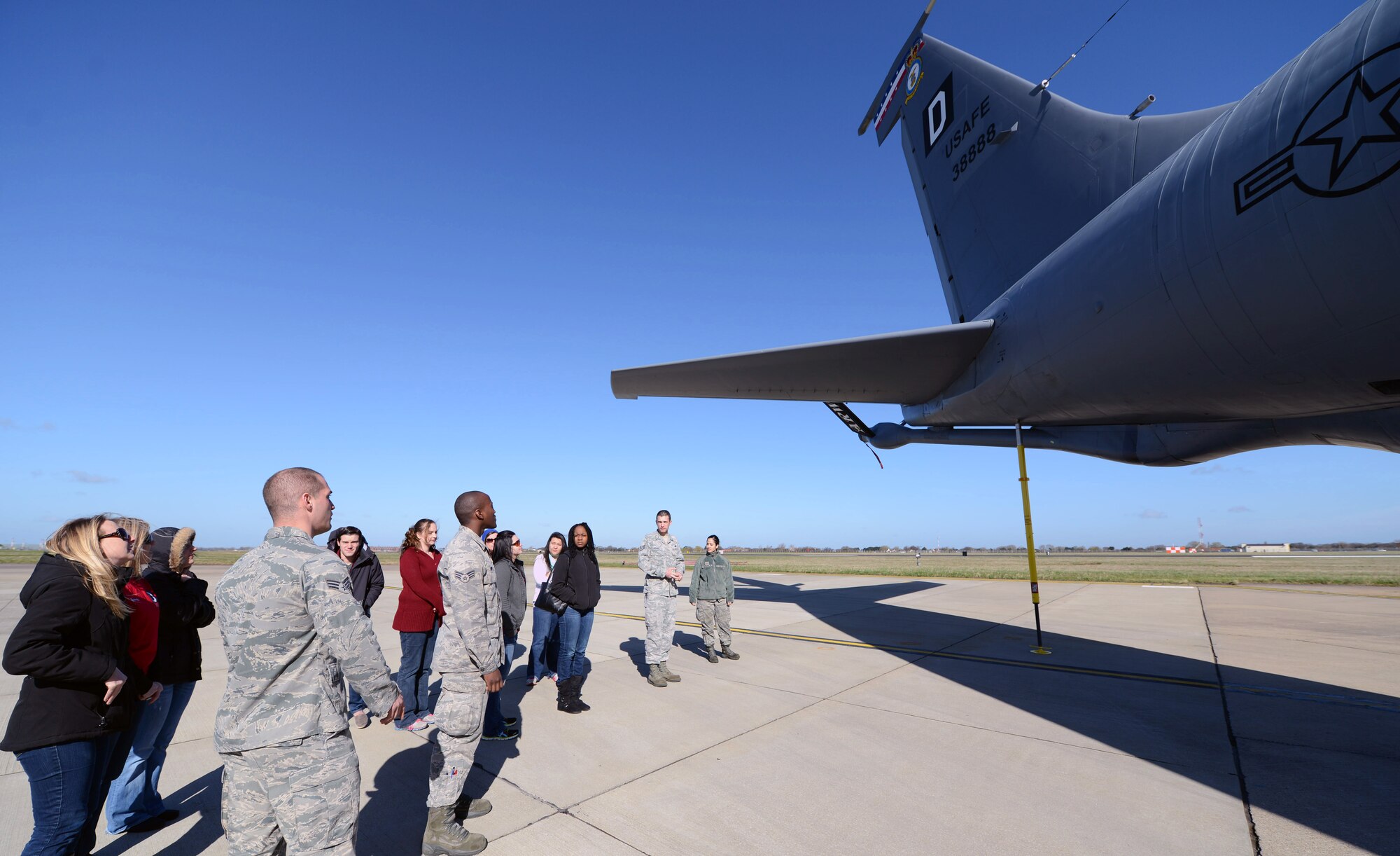 U.S. Air Force 100th Aircraft Maintenance Squadron Airmen give a tour of a KC-135 Stratotanker to their spouses March 21, 2014, on RAF Mildenhall, England. The spouses’ visit started with a tour of the flightline where the spouses were able to explore the aircraft and ask questions. (U.S. Air Force photo by Airman 1st Class Kyla Gifford/Released)