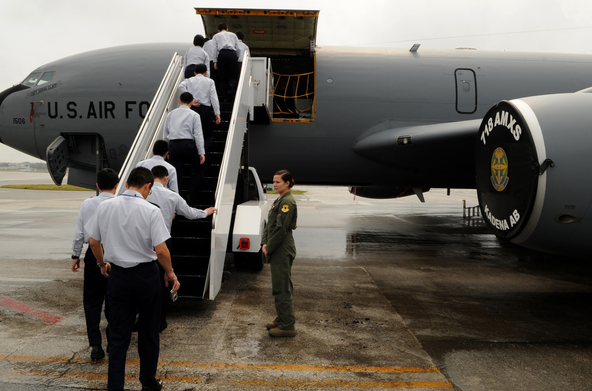 Members of the Japanese Air Self Defense Force board a KC-135 Stratotanker during a tour of Kadena Air Base, Japan, March 20, 2014. The JASDF members learned about the 18th Aeromedical Evacuation Squadron mission and how they conduct their mission on two aircrafts stationed here, the KC-135 Stratotanker and C-130 Hercules. (U.S. Air Force photo by Airman 1st Class Keith James)