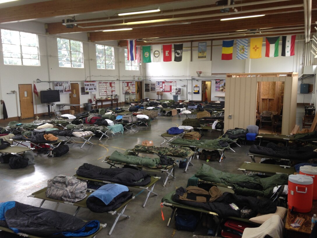 Cots line the floor at the Snohomish Armory, a Washington Army National