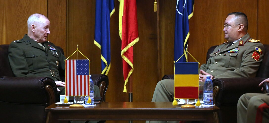 United State Marine Corps Lt. Gen. Richard Tryon, commander of U.S. Marine Corps Forces Command and U.S. Marine Corps Forces, Europe, meets with Romanian Maj. Gen. Nicolae-Ionel Ciuca, chief of Romanian land forces, during Tryon’s official visit to Bucharest, March 18, 2014. Tryon visited with Romanian military officials to discuss continuing the good military relationship between the United States and Romania. United States military forces are currently in Romania assigned to Mihail Kogalniceanu Air Base and the two nations work together during much of the Black Sea Rotational Force deployment. Black Sea Rotational Force 14 is a contingent of Marines and sailors tasked with maintaining positive relations with partner nations, regional stability and increasing interoperability while providing the capability for rapid crisis response, as directed by U.S. European Command, in the Black Sea, Balkan and Caucasus regions of Eastern Europe. (Official Marine Corps photo by Lance Cpl. Scott W. Whiting, BSRF PAO/ Released)