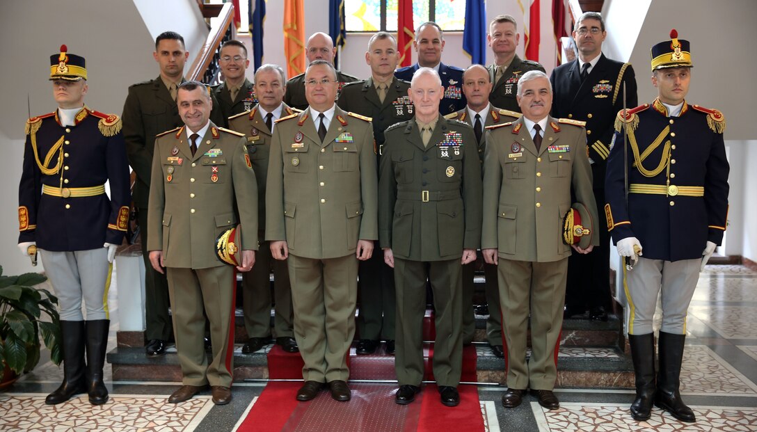 United State Marine Corps Lt. Gen. Richard Tryon (third from right), commander of U.S. Marine Corps Forces Command and U.S. Marine Corps Forces, Europe, poses for a group with his staff and with Romanian Maj. Gen. Nicolae-Ionel Ciuca (third from left), chief of Romanian land forces, and his staff, during Tryon’s official visit to Bucharest, March 18, 2014. Tryon visited with Romanian military officials to discuss continuing the good military relationship between the United States and Romania. United States military forces are currently in Romania assigned to Mihail Kogalniceanu Air Base and the two nations work together during much of the Black Sea Rotational Force deployment. Black Sea Rotational Force 14 is a contingent of Marines and sailors tasked with maintaining positive relations with partner nations, regional stability and increasing interoperability while providing the capability for rapid crisis response, as directed by U.S. European Command, in the Black Sea, Balkan and Caucasus regions of Eastern Europe. (Official Marine Corps photo by Lance Cpl. Scott W. Whiting, BSRF PAO/ Released)