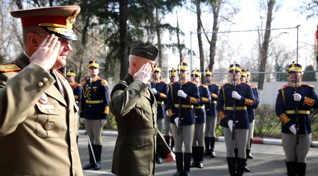United State Marine Corps Lt. Gen. Richard Tryon, commander of U.S. Marine Corps Forces Command and U.S. Marine Corps Forces, Europe, attends a parade in his honor with Romanian Maj. Gen. Nicolae-Ionel Ciuca, chief of Romanian land forces, during Tryon’s official visit to Bucharest, March 18, 2014. Tryon visited with Romanian military officials to discuss continuing the good military relationship between the United States and Romania. United States military forces are currently in Romania assigned to Mihail Kogalniceanu Air Base and the two nations work together during much of the Black Sea Rotational Force deployment. Black Sea Rotational Force 14 is a contingent of Marines and sailors tasked with maintaining positive relations with partner nations, regional stability and increasing interoperability while providing the capability for rapid crisis response, as directed by U.S. European Command, in the Black Sea, Balkan and Caucasus regions of Eastern Europe. (Official Marine Corps photo by Lance Cpl. Scott W. Whiting, BSRF PAO/ Released)