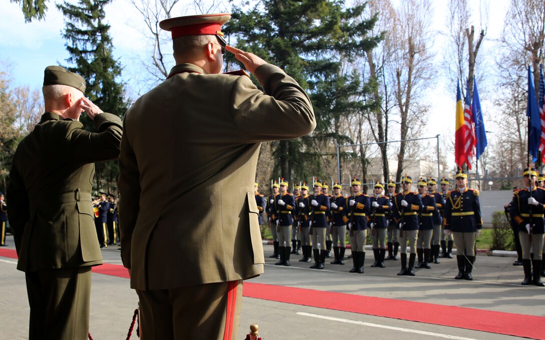 United State Marine Corps Lt. Gen. Richard Tryon, commander of U.S. Marine Corps Forces Command and U.S. Marine Corps Forces, Europe, attends a parade in his honor with Romanian Maj. Gen. Nicolae-Ionel Ciuca, chief of Romanian land forces, during Tryon’s official visit to Bucharest, March 18, 2014. Tryon visited with Romanian military officials to discuss continuing the good military relationship between the United States and Romania. United States military forces are currently in Romania assigned to Mihail Kogalniceanu Air Base and the two nations work together during much of the Black Sea Rotational Force deployment. Black Sea Rotational Force 14 is a contingent of Marines and sailors tasked with maintaining positive relations with partner nations, regional stability and increasing interoperability while providing the capability for rapid crisis response, as directed by U.S. European Command, in the Black Sea, Balkan and Caucasus regions of Eastern Europe. (Official Marine Corps photo by Lance Cpl. Scott W. Whiting, BSRF PAO/ Released)