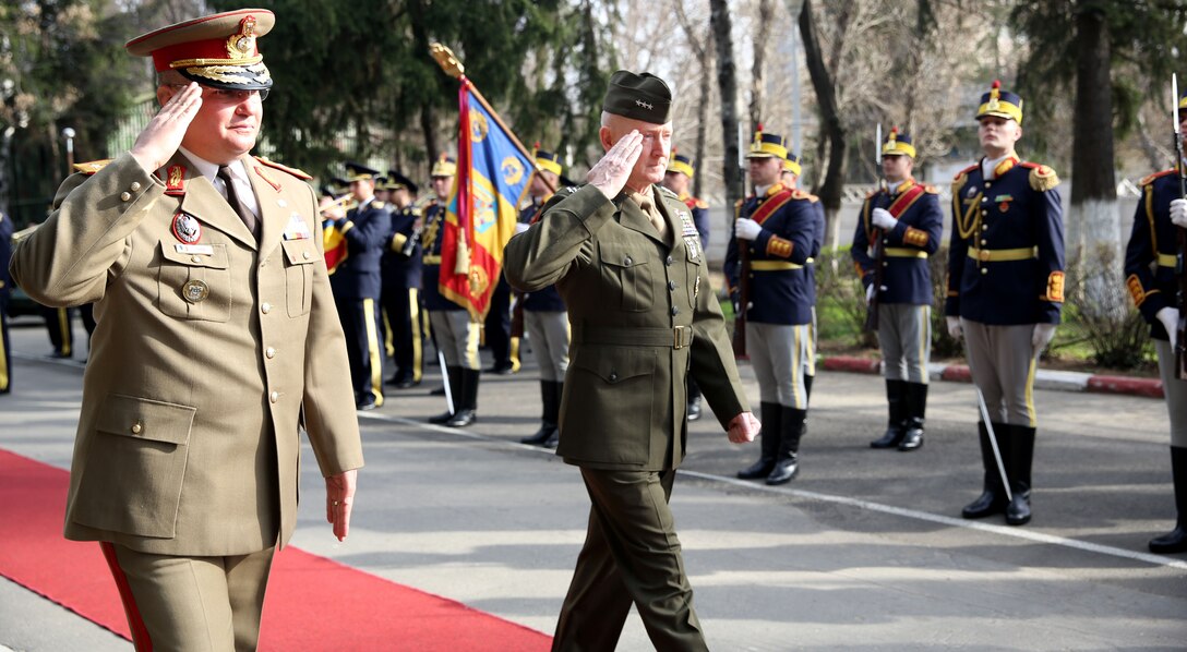 United State Marine Corps Lt. Gen. Richard Tryon, commander of U.S. Marine Corps Forces Command and U.S. Marine Corps Forces, Europe, attends a parade in his honor with Romanian Maj. Gen. Nicolae-Ionel Ciuca, chief of Romanian land forces, during Tryon’s official visit to Bucharest, March 18, 2014. Tryon visited with Romanian military officials to discuss continuing the good military relationship between the United States and Romania. United States military forces are currently in Romania assigned to Mihail Kogalniceanu Air Base and the two nations work together during much of the Black Sea Rotational Force deployment. Black Sea Rotational Force 14 is a contingent of Marines and sailors tasked with maintaining positive relations with partner nations, regional stability and increasing interoperability while providing the capability for rapid crisis response, as directed by U.S. European Command, in the Black Sea, Balkan and Caucasus regions of Eastern Europe. (Official Marine Corps photo by Lance Cpl. Scott W. Whiting, BSRF PAO/ Released)