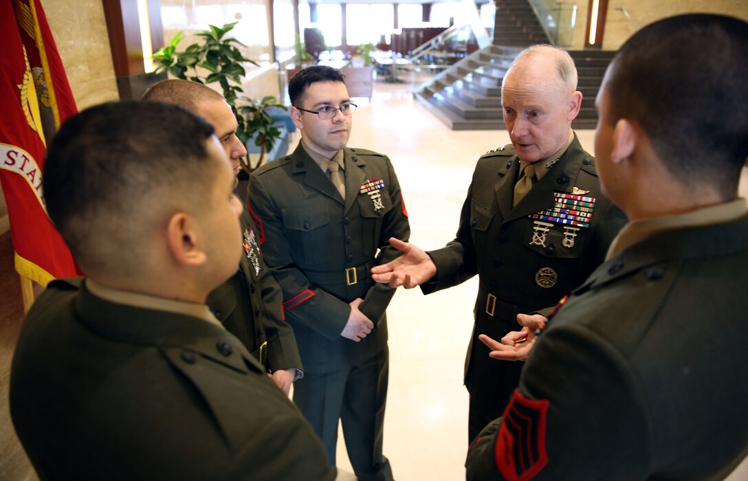 Lieutenant Gen. Richard Tryon, commander of U.S. Marine Corps Forces Command and U.S. Marine Corps Forces, Europe, talks with Marines of the U.S. embassy in Bucharest March 18, 2014. Tryon visited Bucharest to meet with Romanian military officials and also made time to meet Marines at the U.S. embassy. (Official Marine Corps photo by Lance Cpl. Scott W. Whiting, BSRF PAO/ Released)