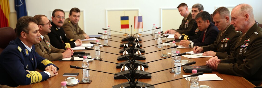 United State Marine Corps Lt. Gen. Richard Tryon, commander of U.S. Marine Corps Forces Command and U.S. Marine Corps Forces, Europe, and his staff, meet with Romanian Lt. Gen. Stefan Danila, Chief of Romanian general staff, and his military officials, during a meeting in Bucharest, March 18, 2014. Tryon visited with Romanian military officials to discuss continuing the good military relationship between the United States and Romania. United States military forces are currently in Romania assigned to Mihail Kogalniceanu Air Base and the two nations work together during much of the Black Sea Rotational Force deployment. Black Sea Rotational Force 14 is a contingent of Marines and sailors tasked with maintaining positive relations with partner nations, regional stability and increasing interoperability while providing the capability for rapid crisis response, as directed by U.S. European Command, in the Black Sea, Balkan and Caucasus regions of Eastern Europe. (Official Marine Corps photo by Lance Cpl. Scott W. Whiting, BSRF PAO/ Released)
