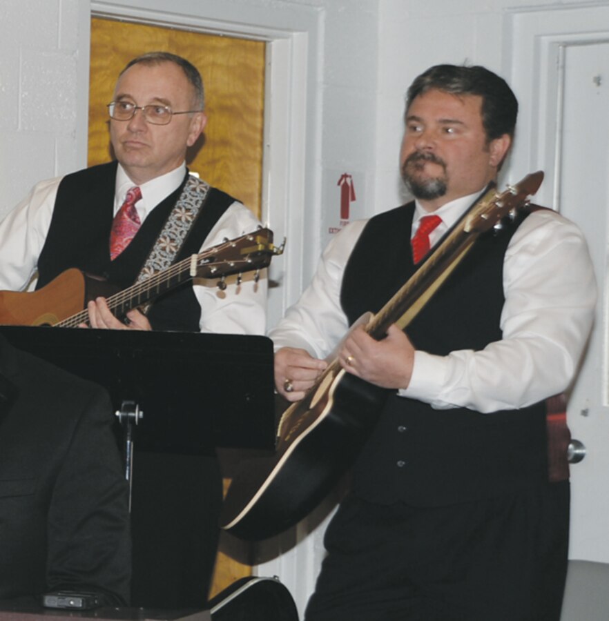 Kent Morrison (left) Marine Corps Logistics Base Albany’s executive director, and Charles Goodson, director, Marine and Family Programs, Marine Corps Community Services, Marine Corps Logistics Base Albany, play their instruments during the Dr. Martin Luther King Jr. observation held here, Jan. 14.