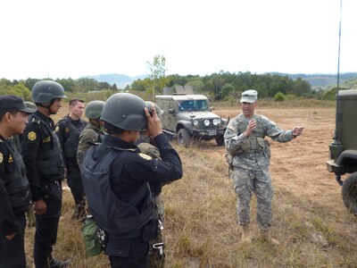 Staff Sgt. Richard Ramirez of the Georgia Army National Guard provides a safety brief to Guatemalan Interagency Task Force Soldiers and police agents prior to their driver's training class in order to build capacity and to enhance their capability in combating transnational criminal organizations and drug trafficking organizations.