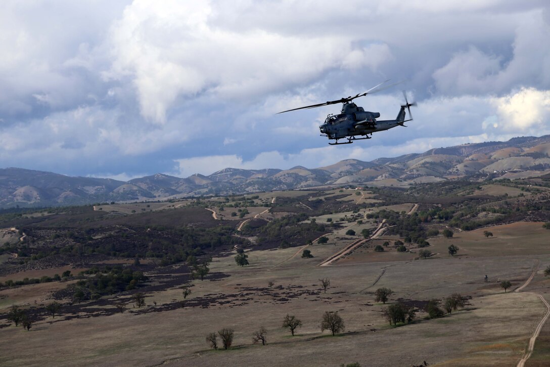 An AH-1Z Cobra with Marine Medium Tiltrotor Squadron 163 (reinforced), 11th Marine Expeditionary Unit, provides fire suport for a simulated tactical air control party (TACP) exercise during Realistic Urban Training Marine Expeditionary Unit Exercise 14-1 (RUTMEUEX) at Camp Roberts, Calif., March 26, 2014.  RUTMEUEX will prepare the 11th MEU Marines for their upcoming deployment, enhancing their combat skills in environments similar to those they may find in future missions. (U.S. Marine Corps photo by Lance Cpl. Laura Y. Raga/Released)