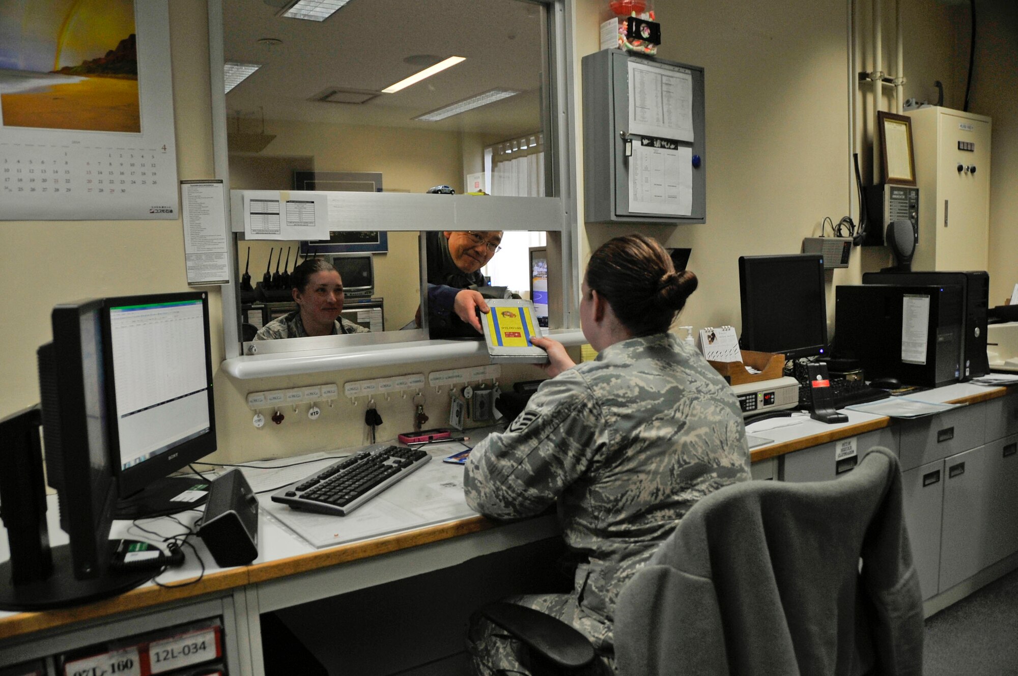 U.S. Air Force Staff Sgt. Jessica Clark-Parrick, 35th Logistics Readiness Squadron fuels controller, processes a request for a fuel truck at Misawa Air Base, Japan, March 25, 2014. The life cycle of fuel begins here at the 35 LRS fuels management flight building where it is inspected in their laboratory before being brought to the flightline. (U.S. Air Force photo/Airman 1st Class Patrick S. Ciccarone)
