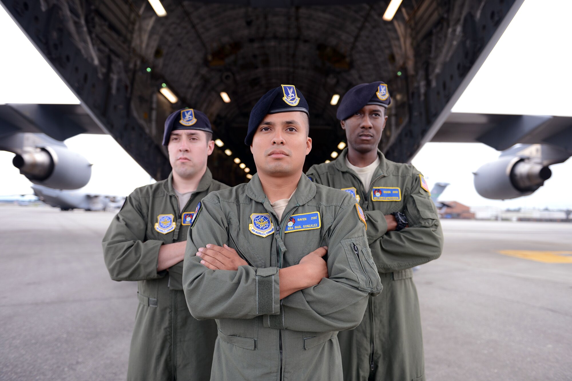 From the left, Senior Airman Chase Vento, Senior Airman Paul Gonzalez, and Senior Airman Curtis McWoodson, 627th Security Forces Squadron phoenix raven members, strike a pose March 13, 2014 at Joint Base Lewis-McChord, Wash. Whether in a remote airfield in Africa or a battlefield in Iraq, Ravens are prepared for sudden violence at any moment. (U.S. Air Force photo/Airman 1st Class Jacob Jimenez)    