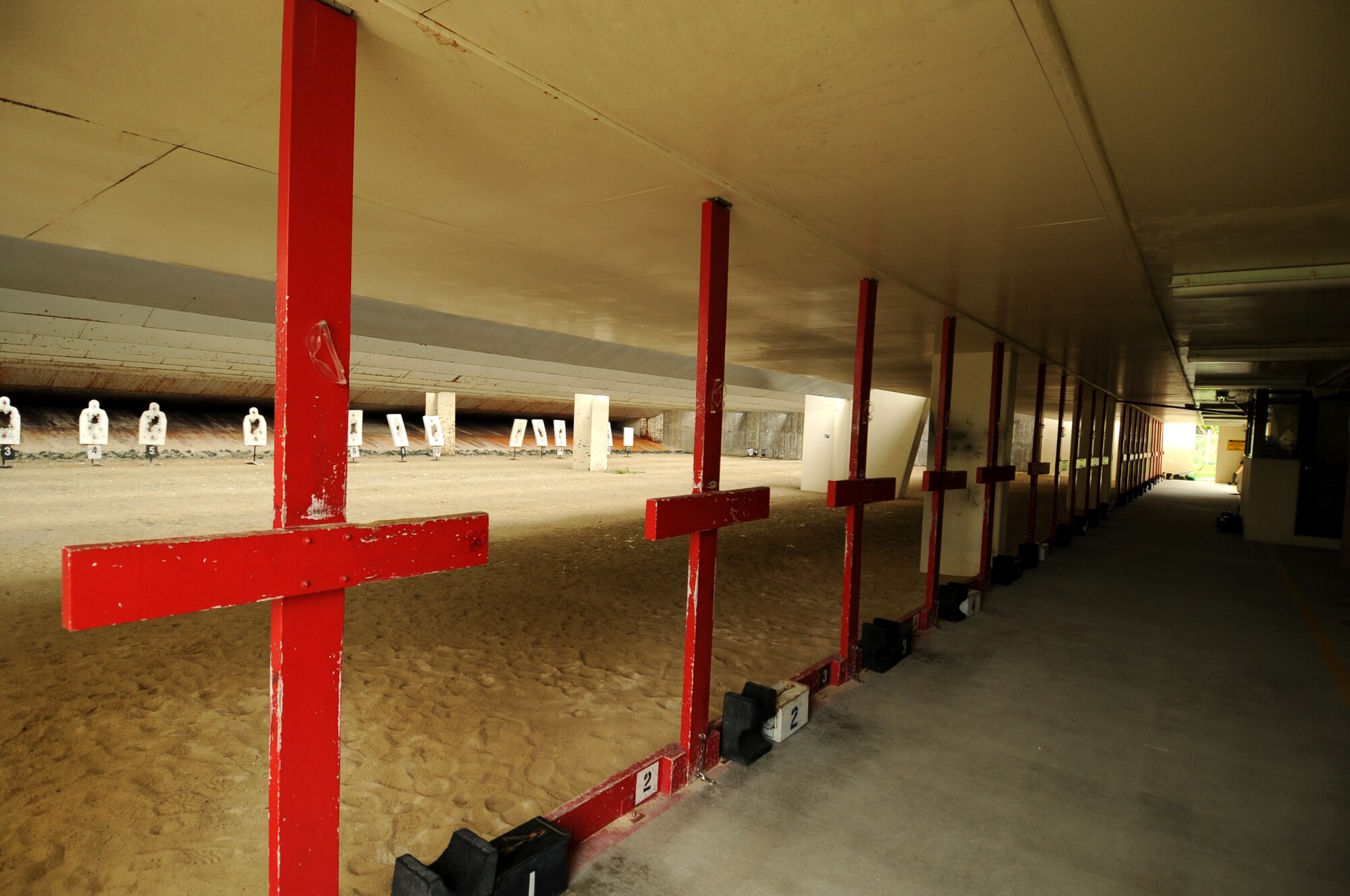 The 18th Security Forces Combat Arms firing range is scheduled to close July 1 on Kadena Air Base, Japan. The range is closing for renovations, which will bring the building into compliance with standards. Renovations will take approximately a year and a half to two years to complete. During that time, Airmen will take a classroom portion at the facility before heading to the U.S. Marine Corps Camp Hansen firing range in order to shoot and qualify on weapons. (U.S. Air Force photo by Airman 1st Class Hailey R. Staker)