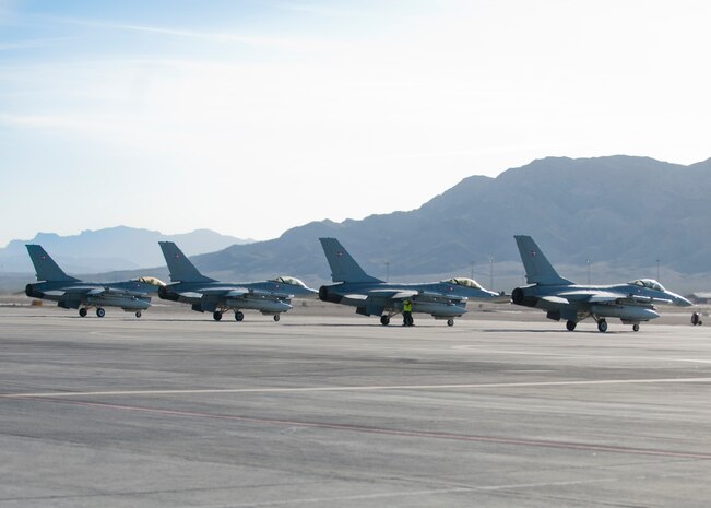 Royal Danish air force F-16 Fighting Falcons prepare for takeoff at Nellis Air Force Base March 27, 2014. Approximately 125 pilots, maintainer and support people from the RDAF came to Nellis to train in the two week long Green Flag exercise. (U.S. Air Force photo by Airman 1st Class Jake Carter)