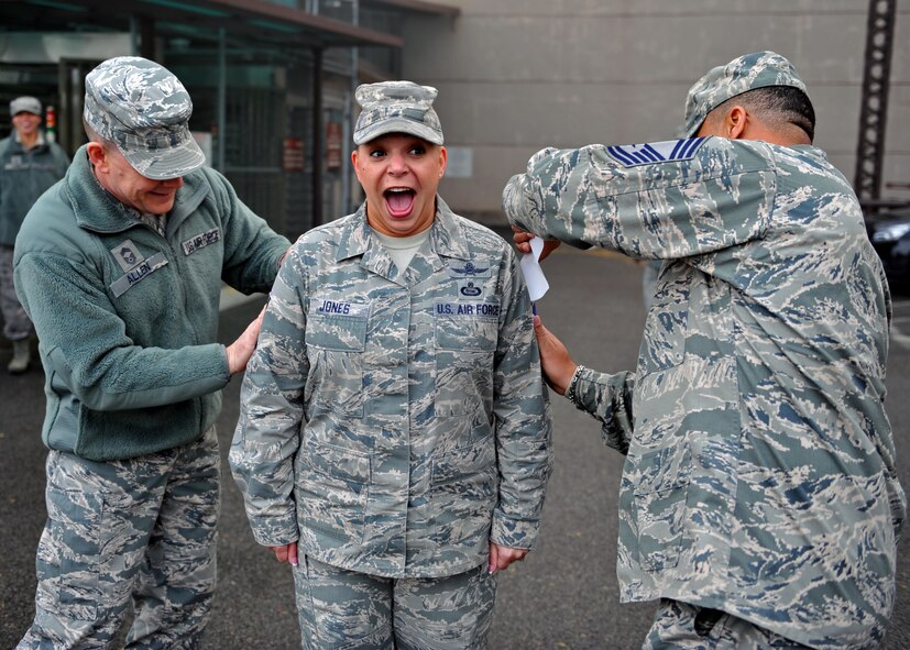 Senior Master Sgt. Kristine Jones, 607th Air Operations Squadron Intelligence, Surveillance and Reconnaissance superintendent, is notified of her selection for Chief Master Sergeant Nov. 15, 2013, Osan Air Base, Republic of Korea. Jones is one of Osan's inspiring women who represents the theme of Women's History Month, "Celebrating Women of Character, Courage and Commitment." (U.S. Air Force photo / Senior Airman Siuta B. Ika)
