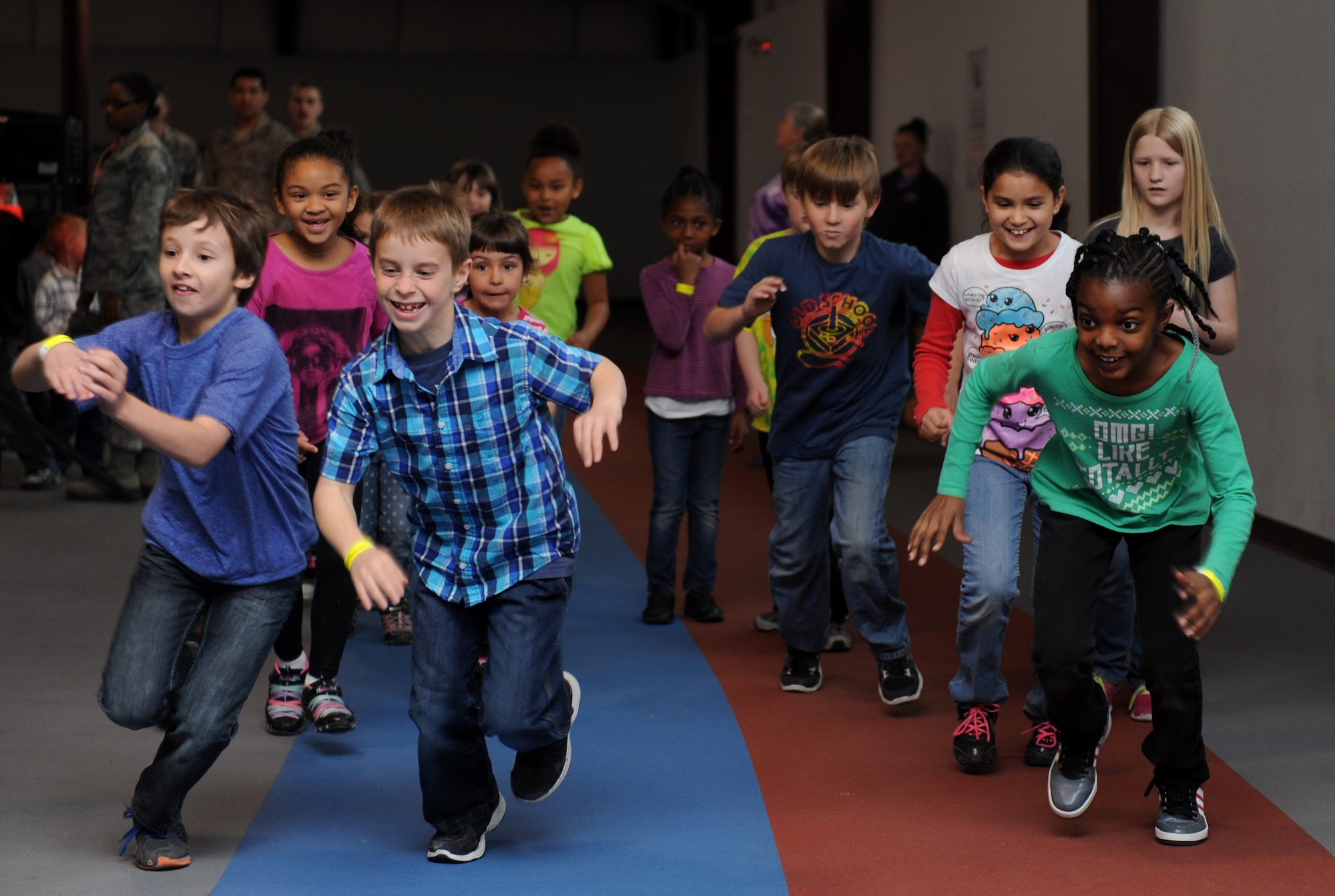 Children at the Youth Center run at the base annex on Mountain Home Air Force Base, Idaho, March 27, 2014. The children participated in a physical fitness challenge modeled after the official Air Force fitness assessment to show the Importance of healthy living. (U.S. Air Force Photo by Airman 1st Class Brittany A. Chase/Released)