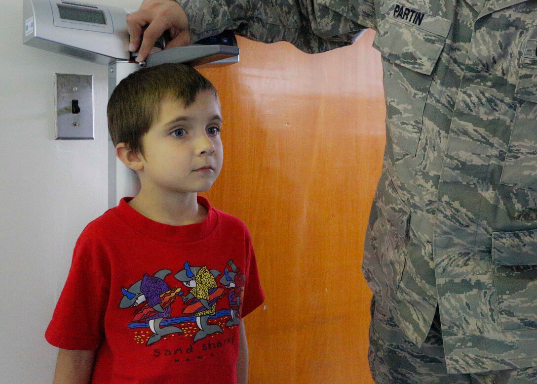 Yokota West elementary student gets his height measured during the Club 2-1-5-0 post-biometric assessment on March 20, 2014, at Yokota Air Base, Japan.  The program aims to be adopted throughout Department of Defense schools to fight rising childhood obesity rates.  (U.S. Air Force photo by Airman 1st Class Soo C. Kim / Released)