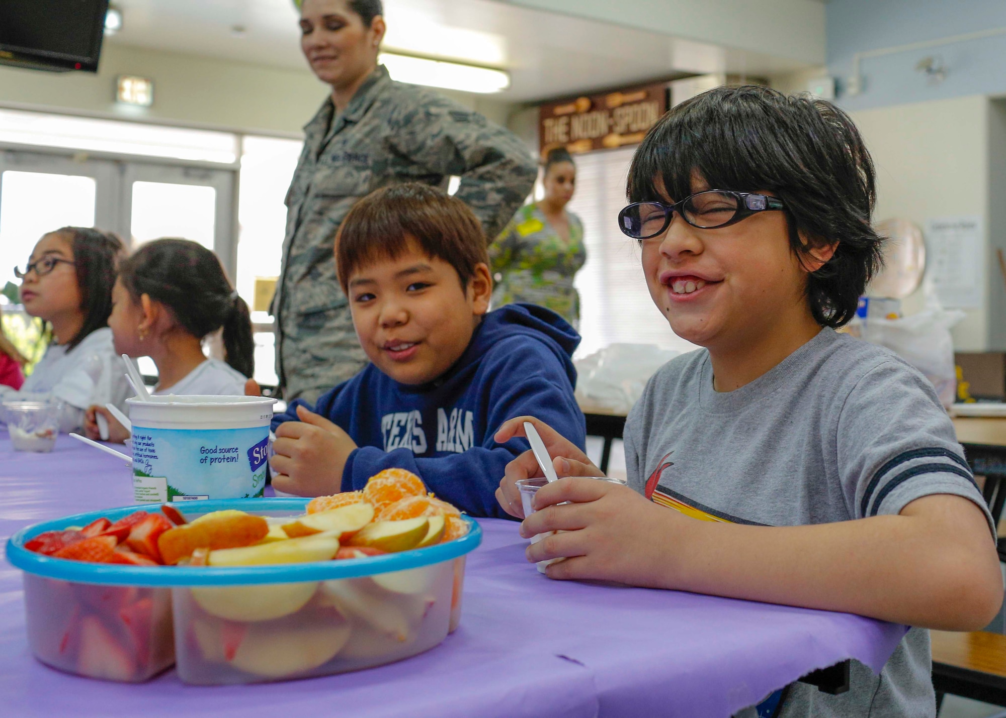Yokota West elementary students enjoy a healthy snack during the last day of the Club 2-1-5-0 assessment on March 20, 2014, at Yokota Air Base, Japan.  Two programs from Yokota were selected as best practice programs for childhood obesity prevention.  (U.S. Air Force photo by Airman 1st Class Soo C. Kim / Released)