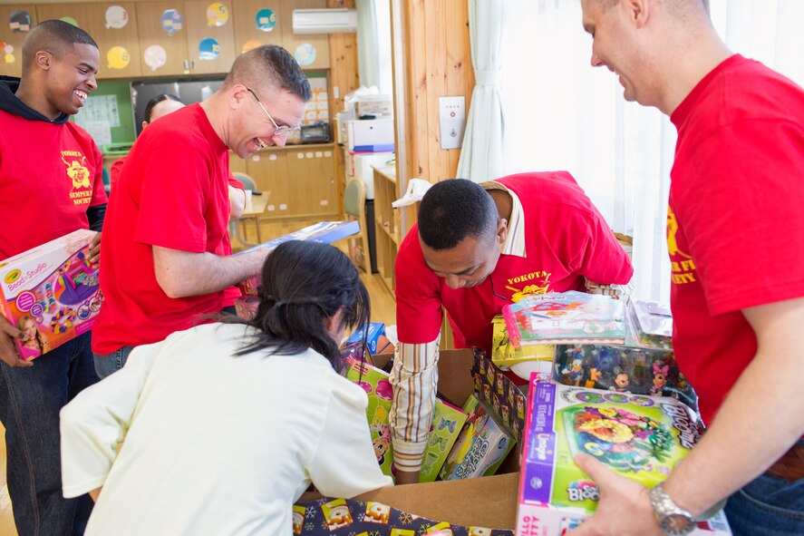 A girl from the Ajiro orphanage chooses a toy from the toy box during an annual toy drop at Akiruno City, Tokyo, Japan, March 24, 2014. The SFS at Yokota delivered more than 200 toys to the orphanage. (U.S. Air Force photo by Osakabe Yasuo/Released)