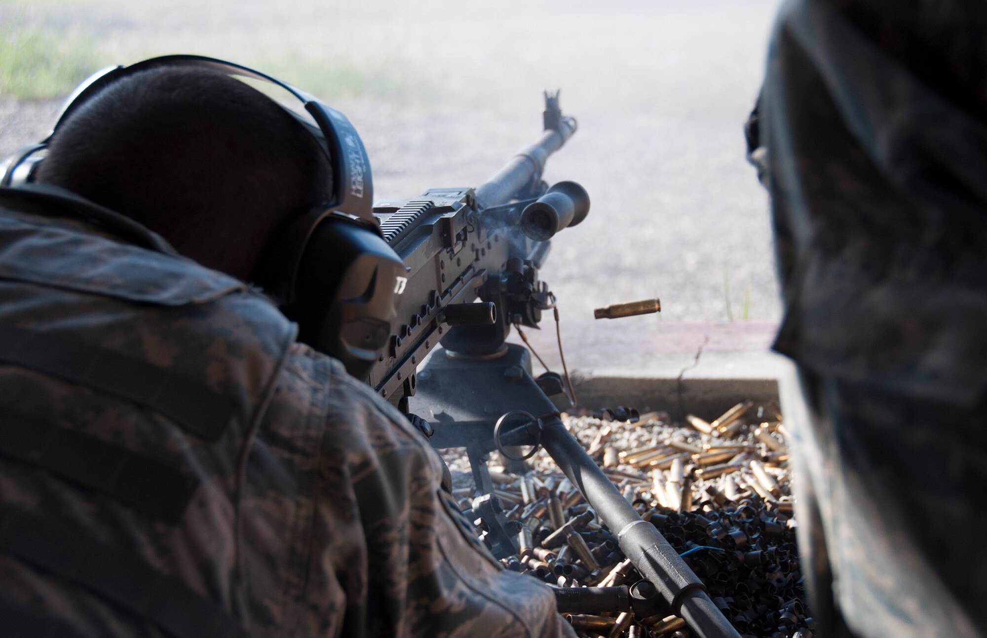TRAVIS AIR FORCE BASE, Calif. -- Reservists from the 349th Security Forces Squadron and 349th Civil Engineer Squadron Explosives Ordnance flight traveled to Beale Air Force Base, Calif., to further familiarize their members with the M240 and M249 heavy weapons, as well as with the M203 mounted grenade launcher, March 23, 2014. (U.S. Air Force photo/Senior Airman Cindy G. Alejandrez)