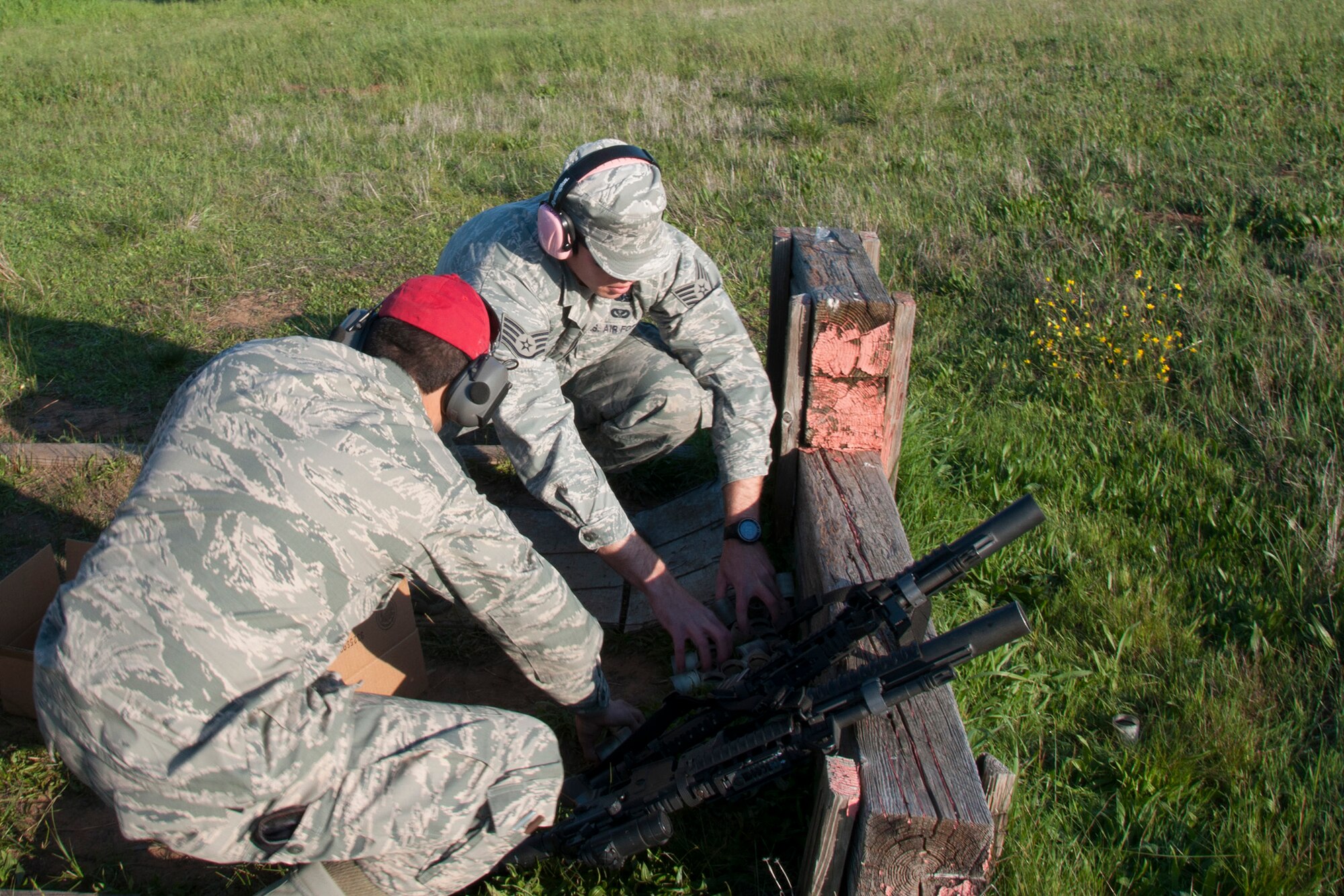 TRAVIS AIR FORCE BASE, Calif. -- Reservists from the 349th Security Forces Squadron and 349th Civil Engineer Squadron Explosives Ordnance flight traveled to Beale Air Force Base, Calif., to further familiarize their members with the M240 and M249 heavy weapons, as well as with the M203 mounted grenade launcher, March 23, 2014. (U.S. Air Force photo/Senior Airman Cindy G. Alejandrez)