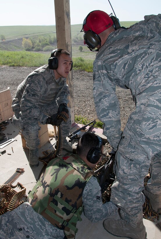 TRAVIS AIR FORCE BASE, Calif. -- Reservists from the 349th Security Forces Squadron and 349th Civil Engineer Squadron Explosives Ordnance flight traveled to Beale Air Force Base, Calif., to further familiarize their members with the M240 and M249 heavy weapons, as well as with the M203 mounted grenade launcher, March 23, 2014. (U.S. Air Force photo/Senior Airman Cindy G. Alejandrez)