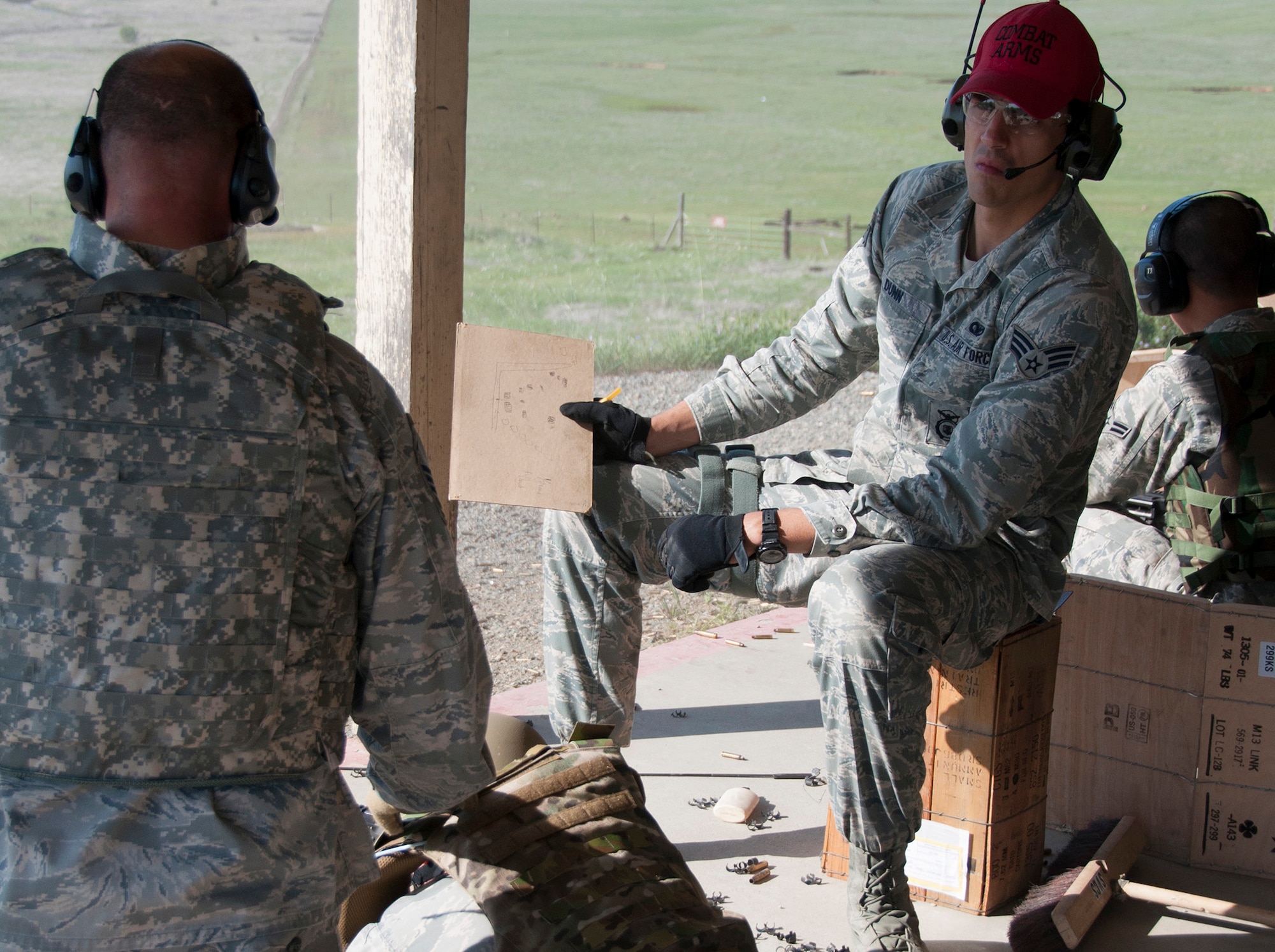 TRAVIS AIR FORCE BASE, Calif. -- Reservists from the 349th Security Forces Squadron and 349th Civil Engineer Squadron Explosives Ordnance flight traveled to Beale Air Force Base, Calif., to further familiarize their members with the M240 and M249 heavy weapons, as well as with the M203 mounted grenade launcher, March 23, 2014. (U.S. Air Force photo/Senior Airman Cindy G. Alejandrez)