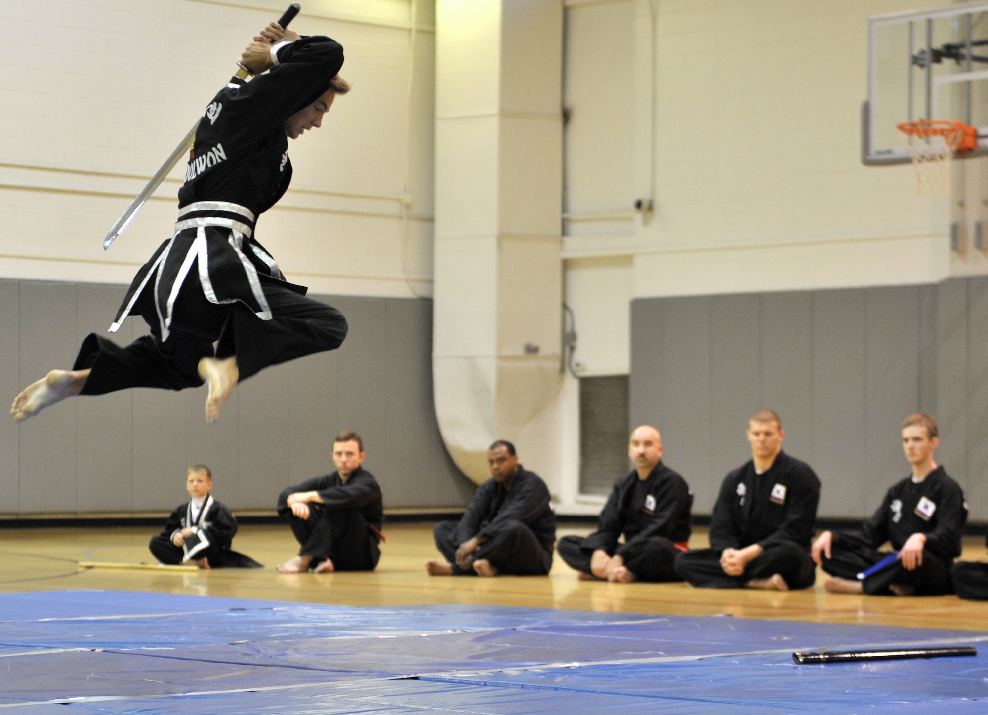 Tripp Davis, Kuk Sool Won black belt student, demonstrates sword techniques during a Kuk Sool Won Black Belt Demo at the Aderholt Fitness Center on Hurlburt Field, Fla, March 22, 2014. Kuk Sool Won is available to Airmen, their families and members of Team Hurlburt three times a week on Hurlburt Field. (U.S. Air Force photo/Senior Airman Kentavist P. Brackin) 