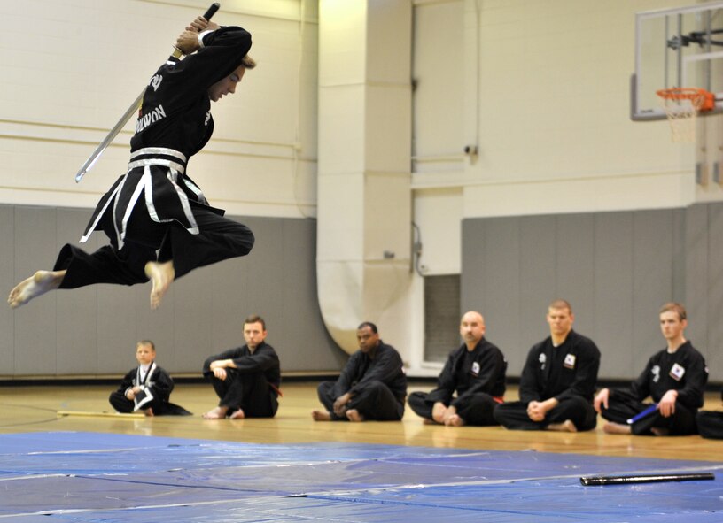 Tripp Davis, Kuk Sool Won black belt student, demonstrates sword techniques during a Kuk Sool Won Black Belt Demo at the Aderholt Fitness Center on Hurlburt Field, Fla, March 22, 2014. Kuk Sool Won is available to Airmen, their families and members of Team Hurlburt three times a week on Hurlburt Field. (U.S. Air Force photo/Senior Airman Kentavist P. Brackin) 