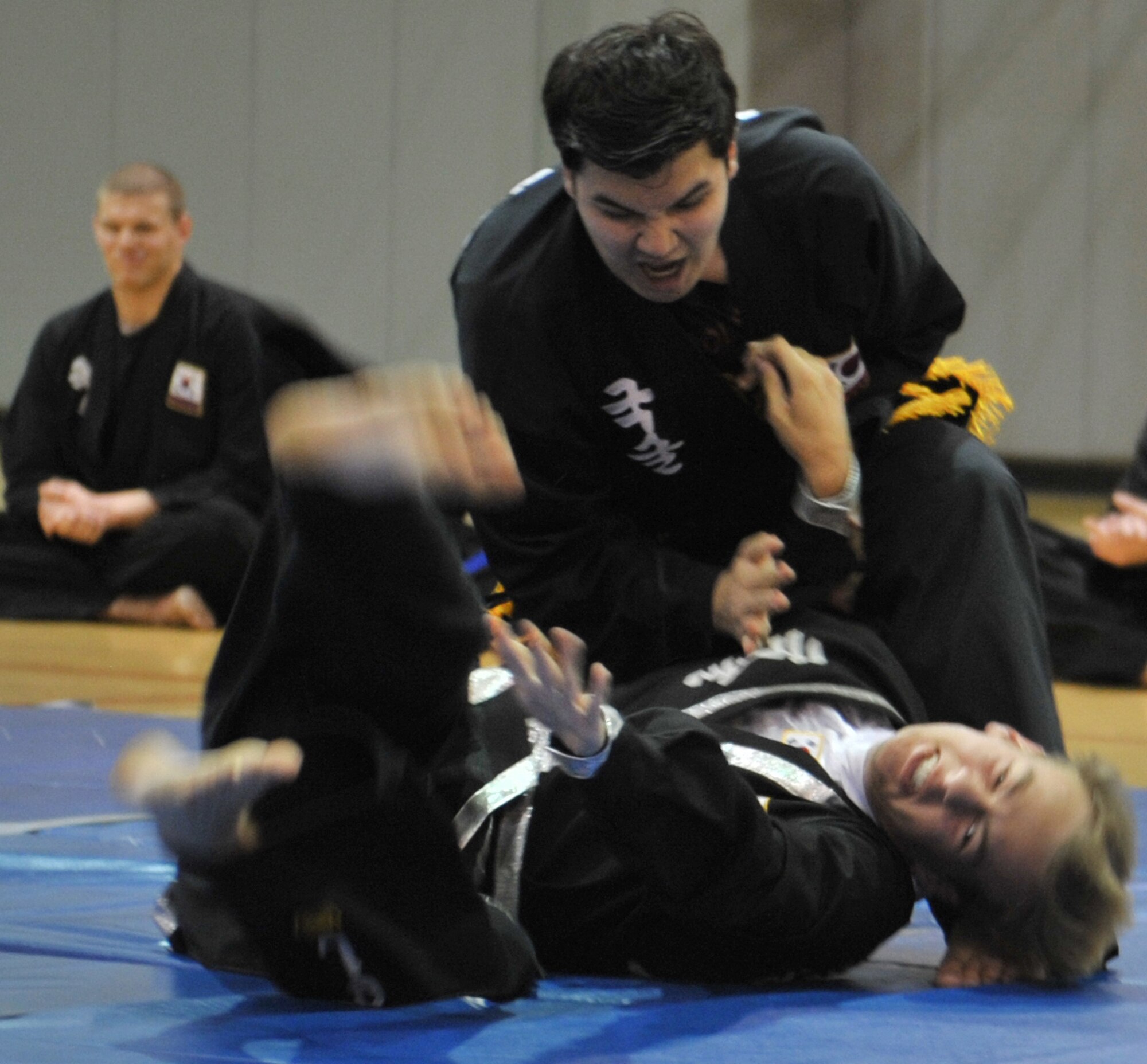 Jakob Onge, newly promoted 1st degree black belt, throws his opponent during a Kuk Sool Won Black Belt Demo at the Aderholt Fitness Center on Hurlburt Field, Fla, March 22, 2014. Onge was one of two students promoted to 1st degree black belt during the demo. (U.S. Air Force photo/Senior Airman Kentavist P. Brackin) 