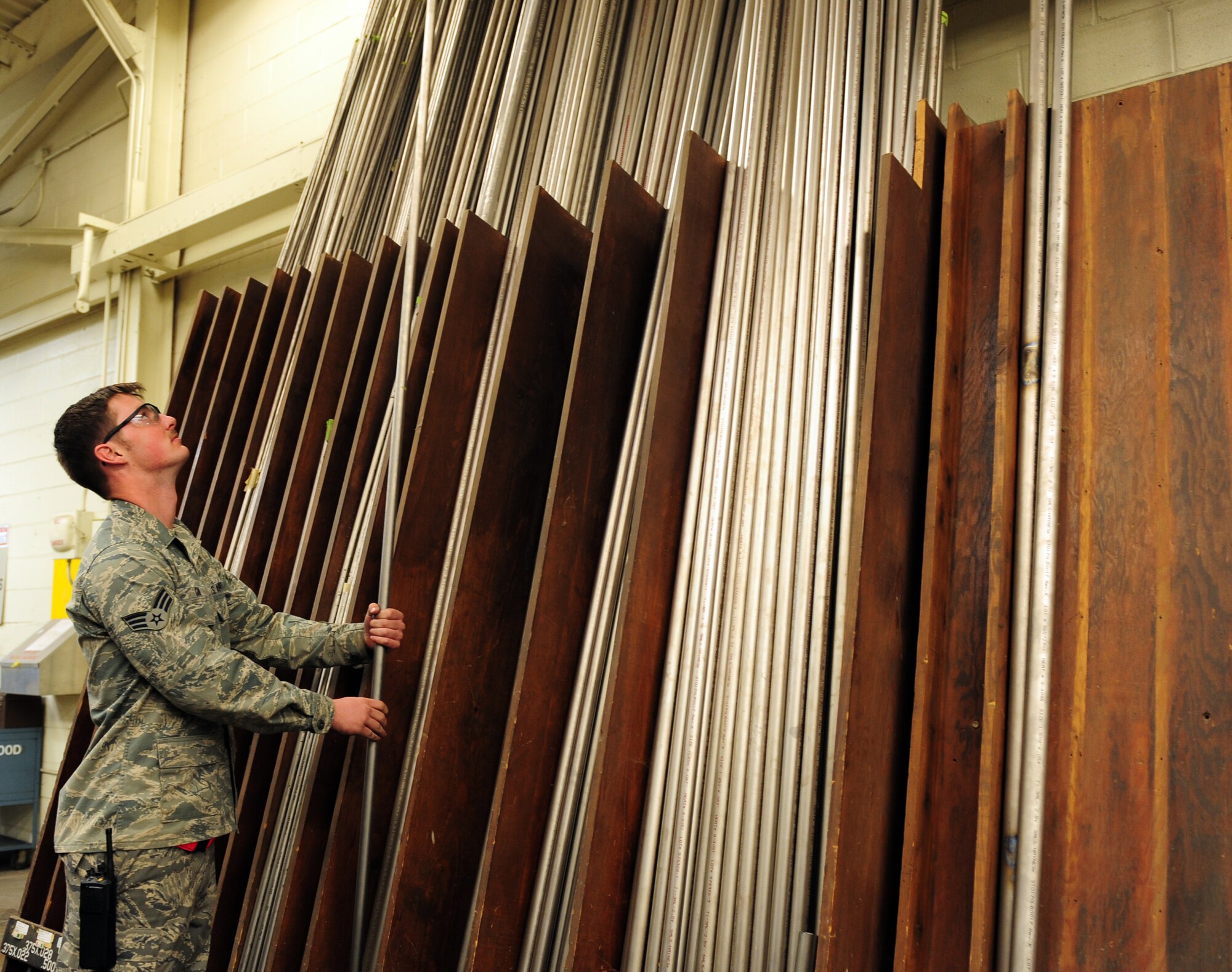 U.S. Air Force Senior Airman Tyler Gann, 7th Equipment Maintenance Squadron aircraft structural maintenance, selects a piece of tubing March 26, 2014, at Dyess Air Force Base, Texas. Different tube sizes and types are used for different applications on the B-1B Lancer. Titanium, for example, is used for hydraulic pressure lines. Each tube must be cut and shaped perfectly, to ensure proper fit. (U.S. Air Force photo by Senior Airman Kia Atkins/Released)