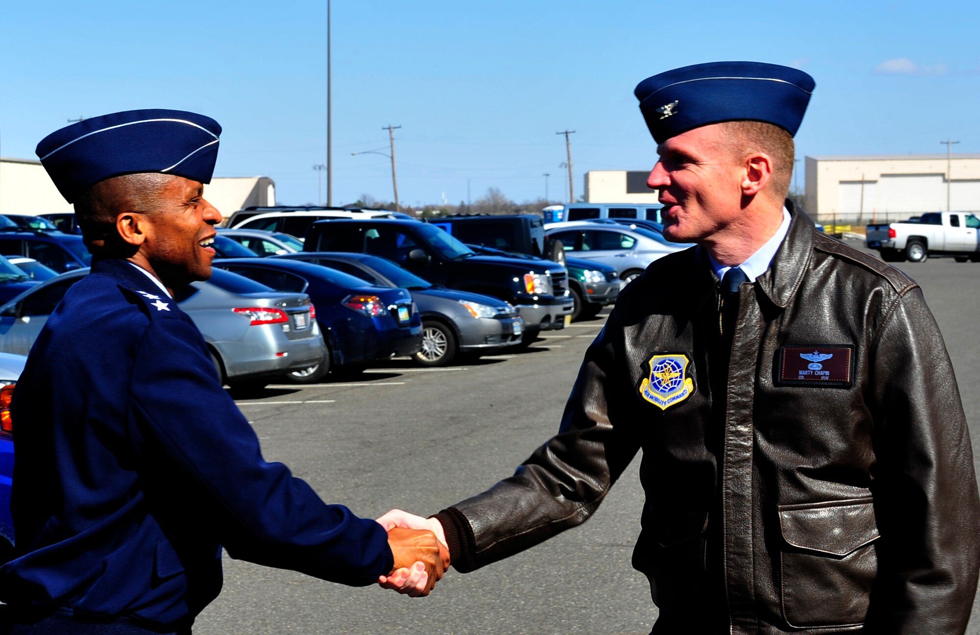 Lt. Gen. Darren McDew, 18th Air Force commander, greets Col. Marty Chapin, 621st Contingency Response Wing commander, at the Global Reach Deployment Center at Joint Base McGuire-Dix-Lakehurst, N.J., Mar. 26. The visit to the CRW was just one of many stops made by McDew including the 87th Air Base Wing, 305th Air Mobility Wing, and the Expeditionary Center. (U.S. Air Force photo by Staff Sgt. Gustavo Gonzalez)