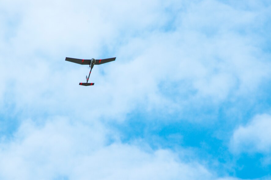 A U.S. Air Force RQ-11B Raven flies at Moody Air Force Base, Ga., March 27, 2014. The Raven can fly up to 60 miles per hour for 90 minutes on a fully-charged lithium-ion battery. (U.S. Air Force photo by Airman 1st Class Ryan Callaghan/Released)