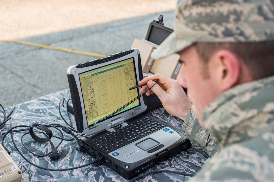 U.S. Air Force Senior Airman Samuel Lewis, 824th Base Defense Squadron fire team member, checks coordinates on a map during preflight preparations at Moody Air Force Base, Ga., March 26, 2014. Lewis is one of 45 qualified operators in the 820th Base Defense Group. (U.S. Air Force photo by Airman 1st Class Ryan Callaghan/Released)