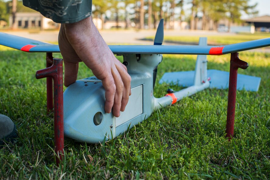 A U.S. Air Force RQ-11B Raven sits in the grass during preflight preparations at Moody Air Force Base, Ga., March 26, 2014. The Raven’s primary function is reconnaissance and surveillance at low altitudes and includes two cameras with an optional infrared camera to provide real-time situational awareness and target information to Airmen on the ground. (U.S. Air Force photo by Airman 1st Class Ryan Callaghan/Released)