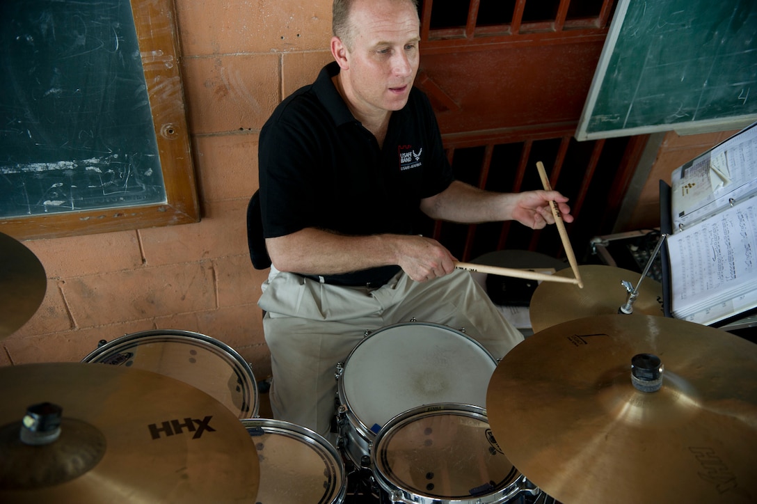 Master Sgt. Steven Pryzyzcki plays drums with the U.S. Air Forces in Europe Band ensemble Touch n' Go at the Dom Bosco School in Luanda, Angola, March 26, 2014. The band is in Angola as part of African Partnership Flight Angola 2014, which is an event providing a collaborative learning environment for the Angolan, U.S. and Zambian air forces. (U.S. Air Force photo/Tech. Sgt. Benjamin Wilson)(Released)