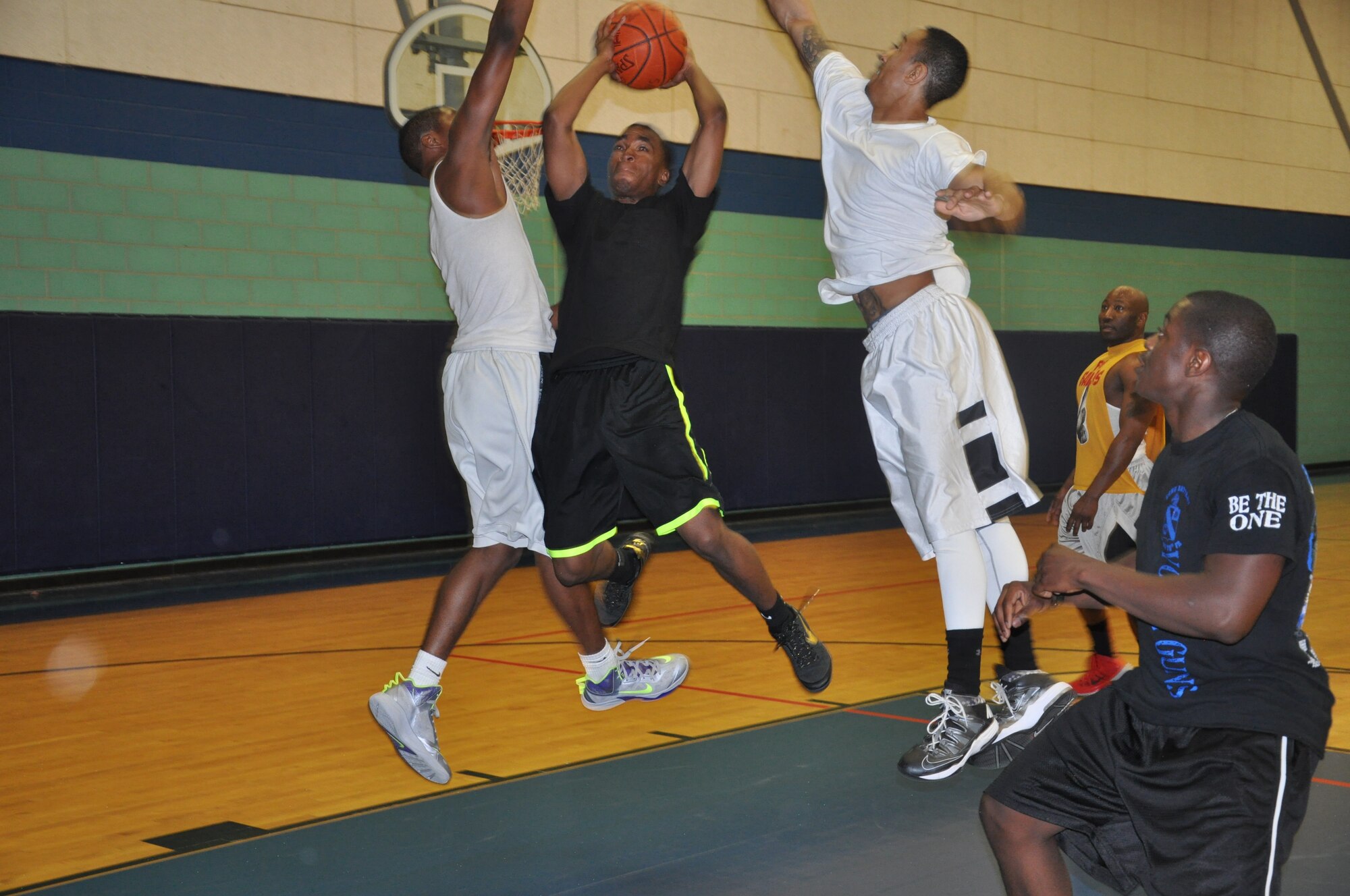 GOODFELLOW AIR FORCE BASE, Texas- Team Freed Boosie, Army 344th Military Intelligence Battalion members, and team Stay Humbles, 17th Communications Squadron and San Angelo community members, compete for the title of Goodfellow 2014 March Madness Champions at the Mathis Fitness Center here March 22. The competition consisted of 14 teams in a series of 3-on-3 matches. (U.S. Air Force photo/ Airman 1st Class Erica Rodriguez)