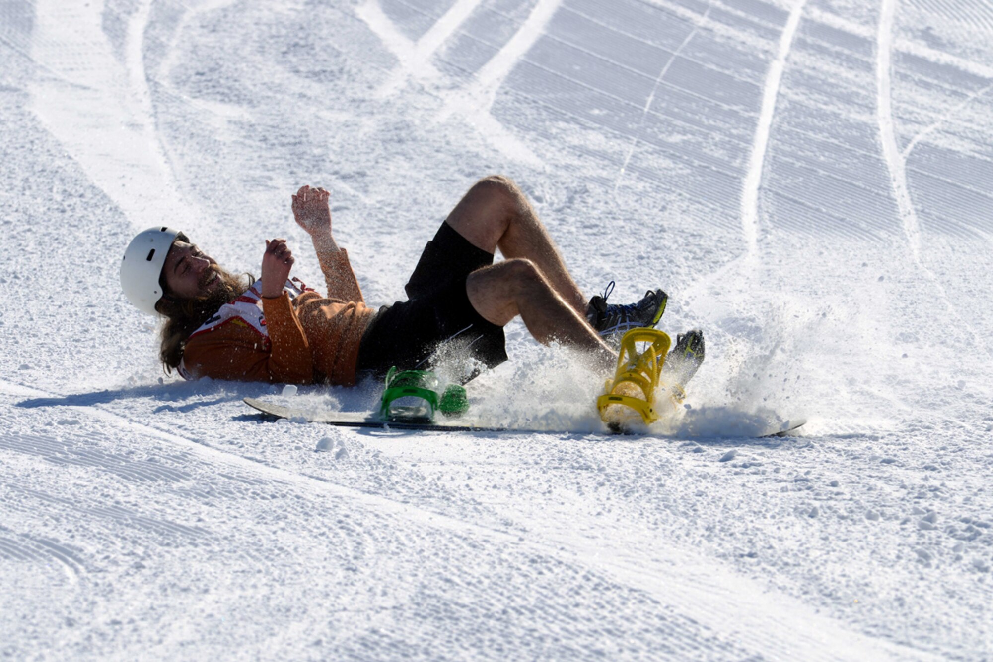 JOINT BASE ELMENDORF-RICHARDSON-- Alex Flores wipes out during the terrain park competition during the 673d Force Support Squadron?s Spring Meltdown event at the Hillberg Ski Area on Joint Base Elmendorf-Richardson, Alaska, March 22, 2014. Service members, civilians and dependents competed for scores based on technique, flare and style. (U.S. Air Force photo/Staff Sgt. Sheila deVera)