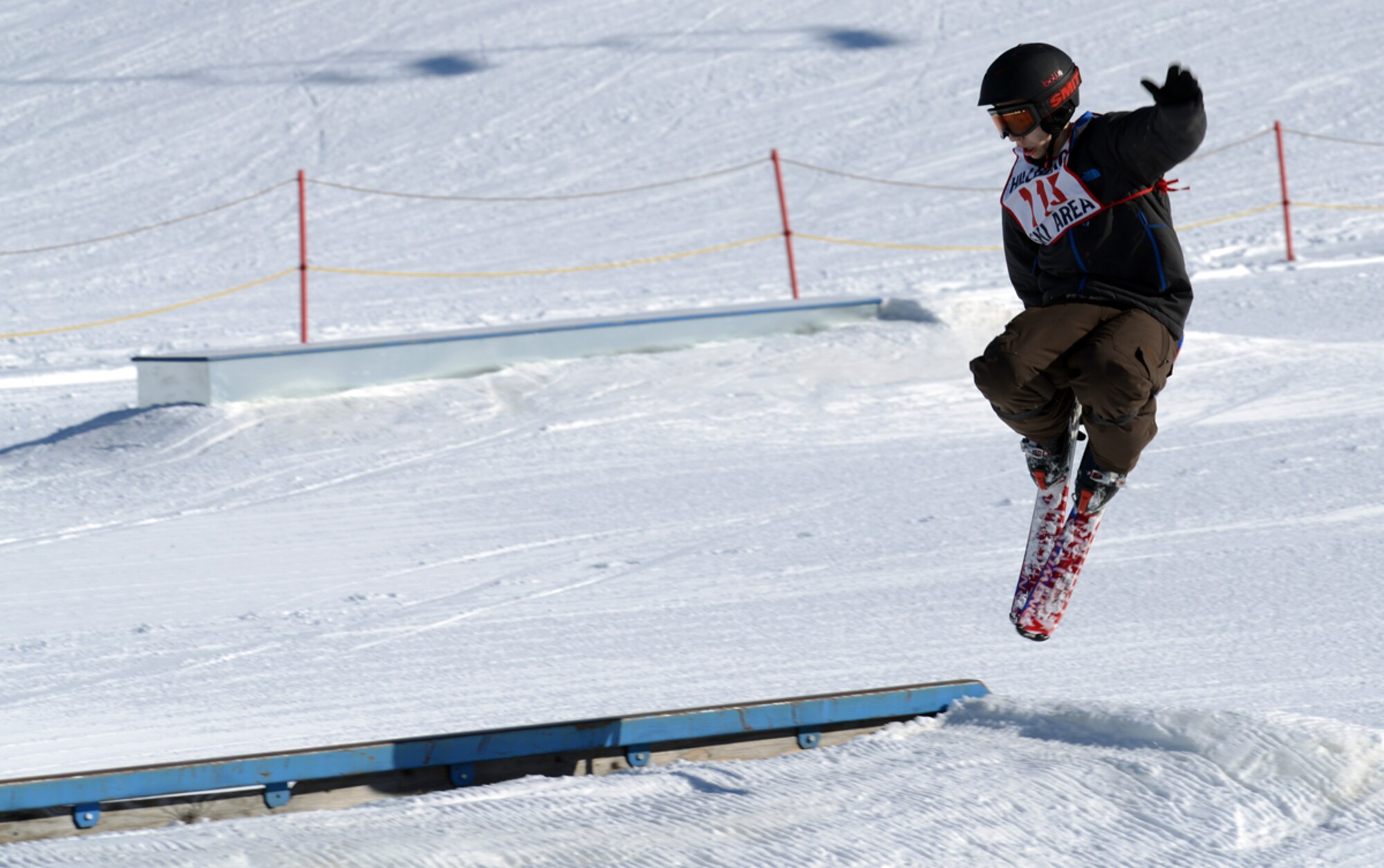 JOINT BASE ELMENDORF-RICHARDSON-- Luke Davis, 15, performs a tail grab during the 673d Force Support Squadron?s Spring Meltdown event at the Hillberg Ski Area on Joint Base Elmendorf-Richardson, Alaska, March 22, 2014. The event included the commander?s bobsled race, a terrain park competition, an up-hill/down-hill race and the Slush Cup competition. Davis took first place in the under-16 terrain park ski competition. (U.S. Air Force photo/Staff Sgt. Sheila deVera)