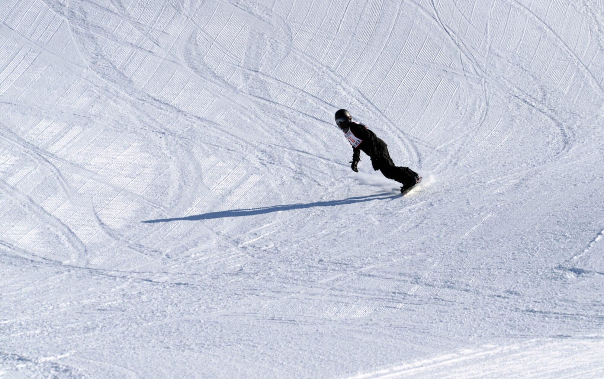 JOINT BASE ELMENDORF-RICHARDSON-- Nathan Guilleimo, 15, comes down the mountain during the 673d Force Support Squadron?s Spring Meltdown event at the Hillberg Ski Area on Joint Base Elmendorf-Richardson, Alaska, March 22, 2014. The event included the commander?s bobsled race, a terrain park competition, an up-hill/down-hill race and the Slush Cup competition. (U.S. Air Force photo/Staff Sgt. Sheila deVera)