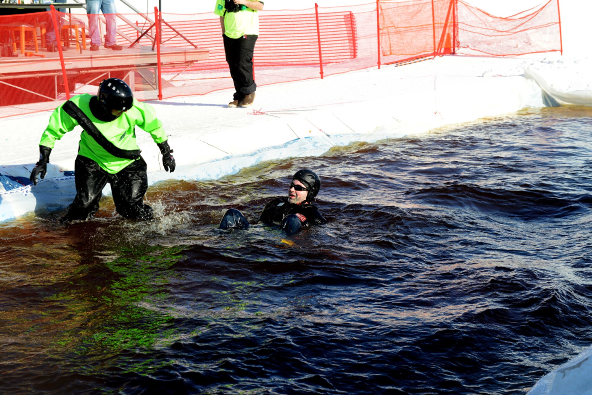 JOINT BASE ELMENDORF-RICHARDSON-- John Pratt surfaces from underwater at the Slush Cup on Joint Base Elmendorf-Richardson, Alaska, March 23, 2014. Pratt works as a recreation employee for the 673d Force Support Squadron at the Hillberg Ski Area. (U.S. Air Force photo/Airman 1st Class Ty-Rico Lea)