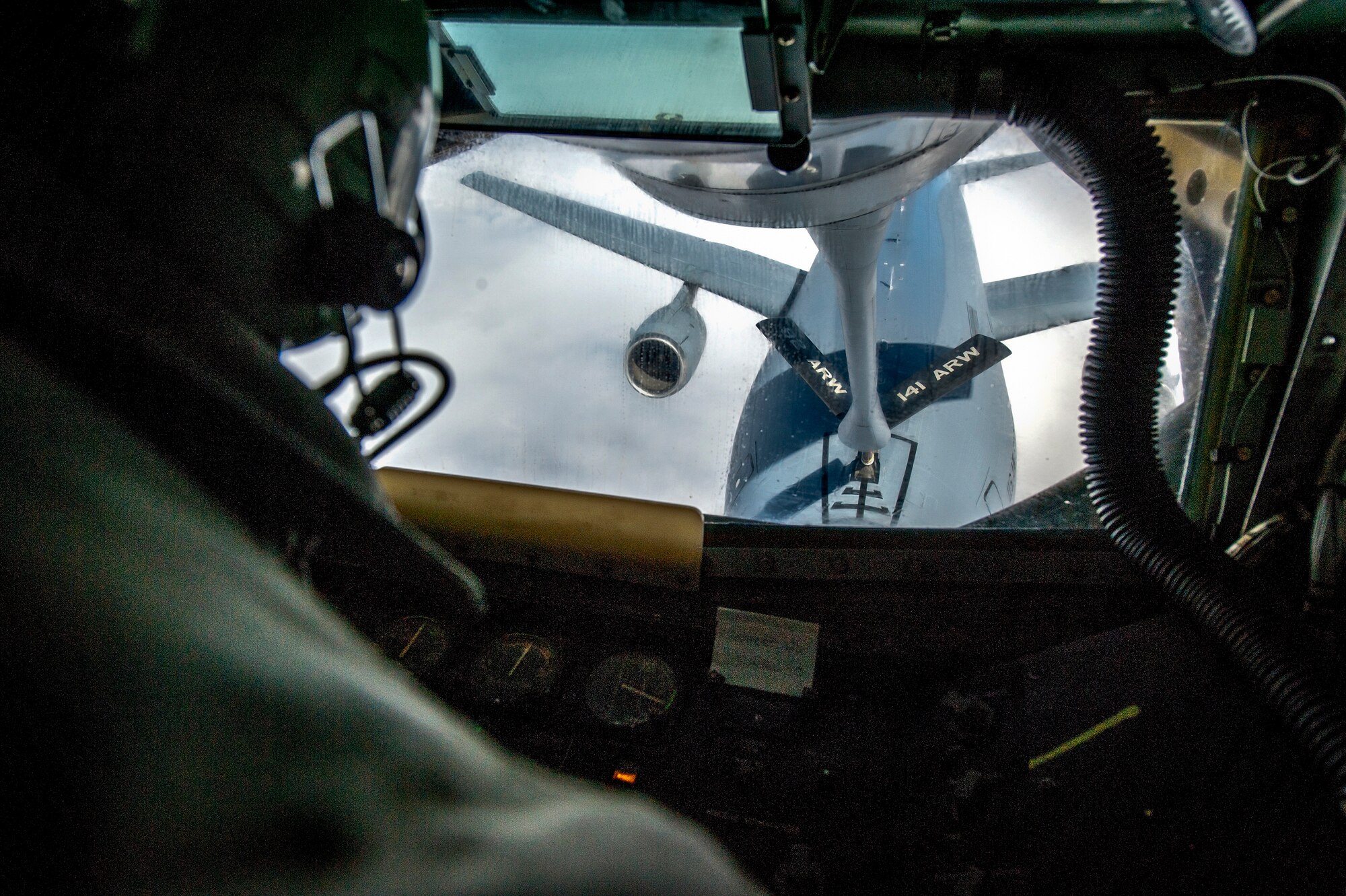 Staff Sgt. Ryan Kiser connects with a KC-10 Extender from Travis Air Force Base, Calif., during an air refueling mission and incentive flight on board a 92nd Air Refueling Wing KC-135 Stratotanker over Oregon and California, March 26, 2014. The KC-135 provides the core aerial refueling capability for the U.S. Air Force and has excelled in this role for more than 50 years. Kiser is a 92nd Air Refueling Squadron boom instructor and a Rancho Cucamonga, Calif., native. (U.S. Air Force photo by Staff Sgt. Benjamin W. Stratton)