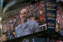 Senior Airman William Harris, 4th Communications Squadron cyber operations technician, is shown on the scoreboard during a hockey game, March 16, 2014, in Raleigh, N.C. Harris was recognized during the Carolina Hurricanes’ Military Appreciation Day game as the 4th Fighter Wing’s Airman of the Year. (U.S. Air Force photo/Airman 1st Class Aaron J. Jenne)